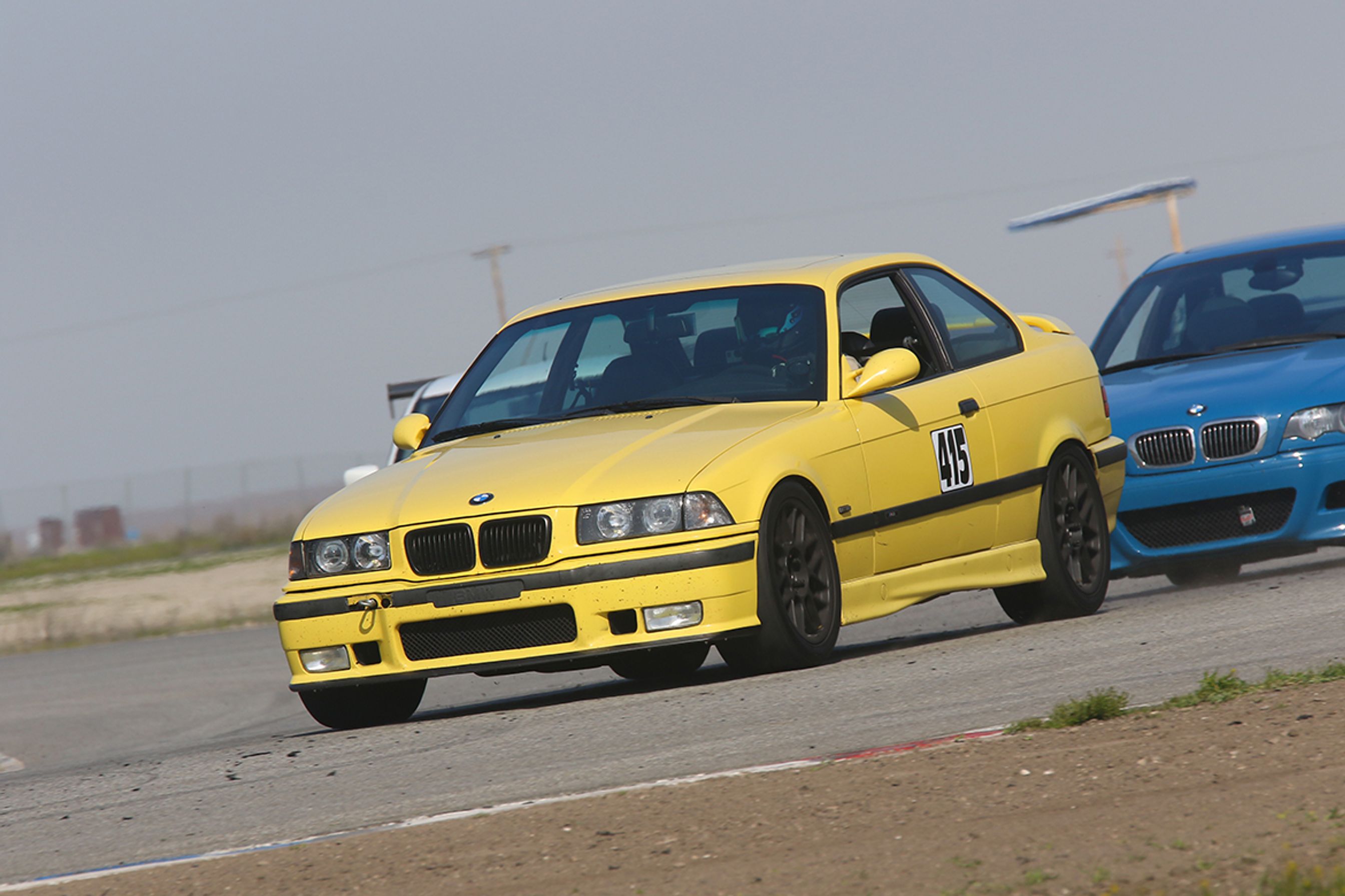Yellow BMW E36 M3 with 17" ARC-8 Apex wheels in Satin Black