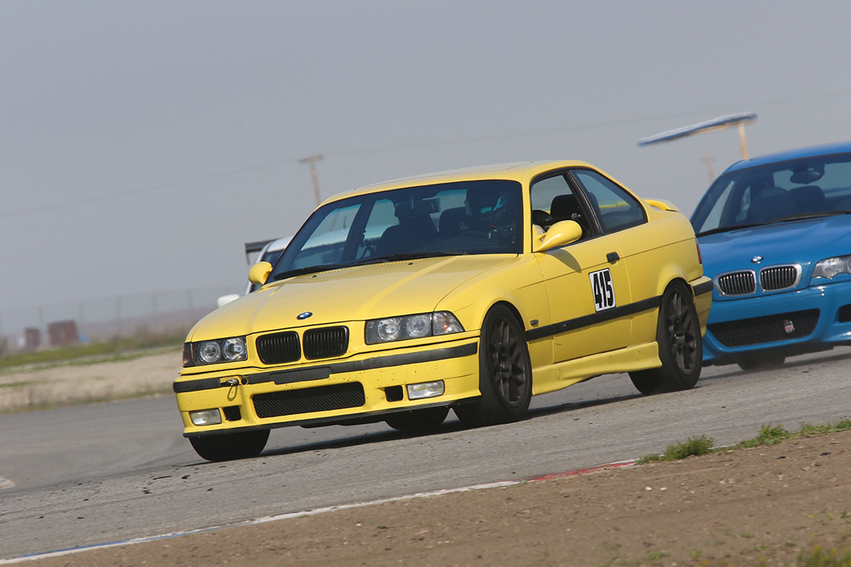 Yellow BMW E36 M3 with 17" ARC-8 Apex wheels in Satin Black