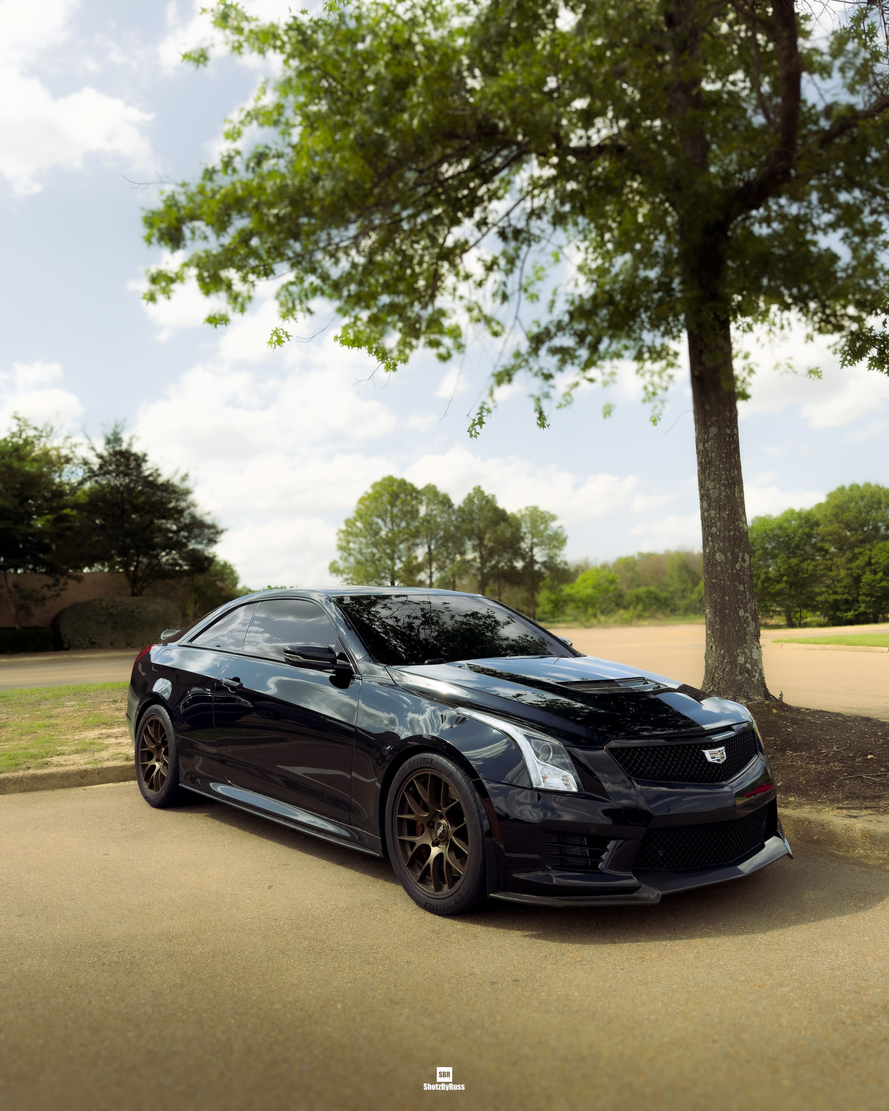 Black Cadillac ATS-V with 18" EC-7 Apex wheels in Satin Bronze