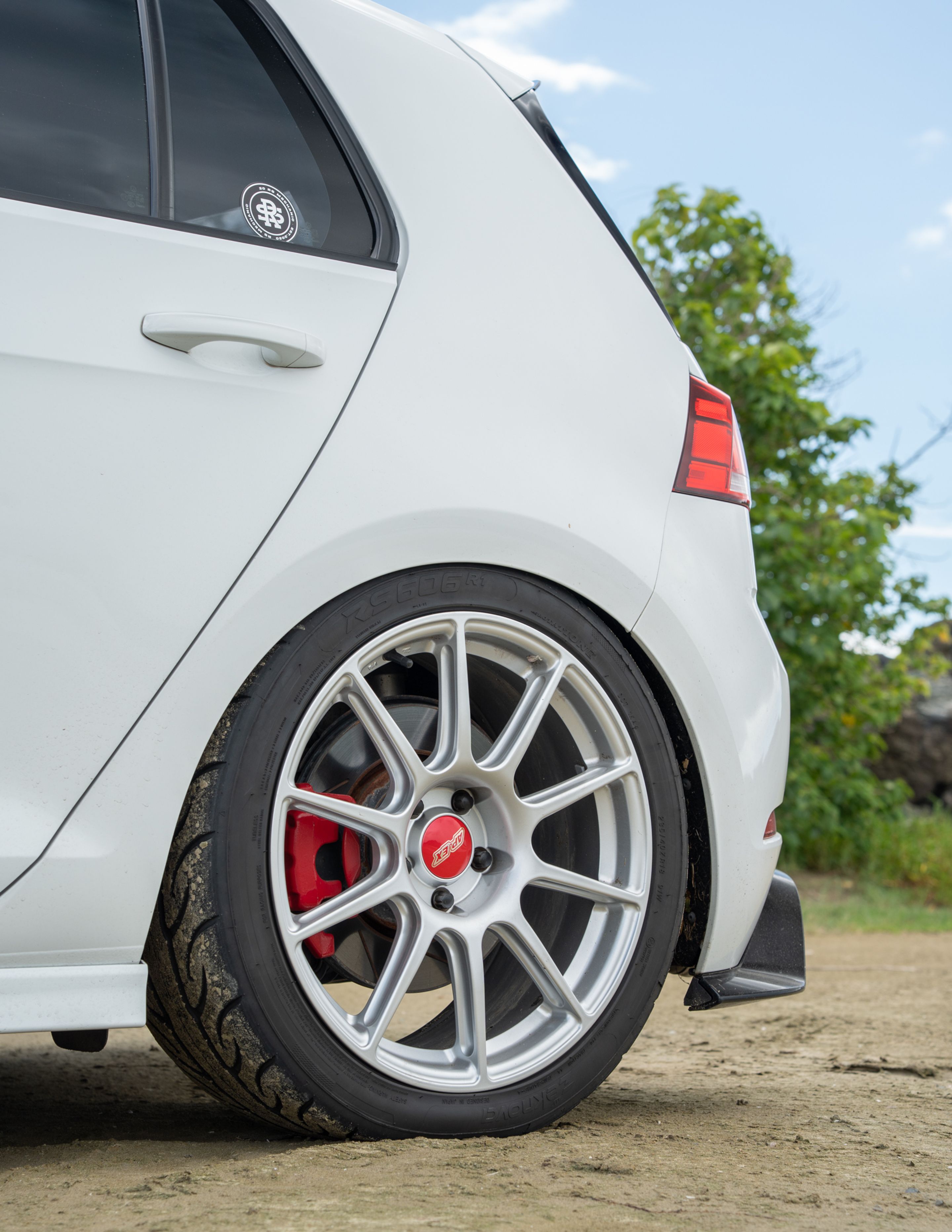 White VW MK7 GTI with 18" SM-10 Apex wheels in Race Silver