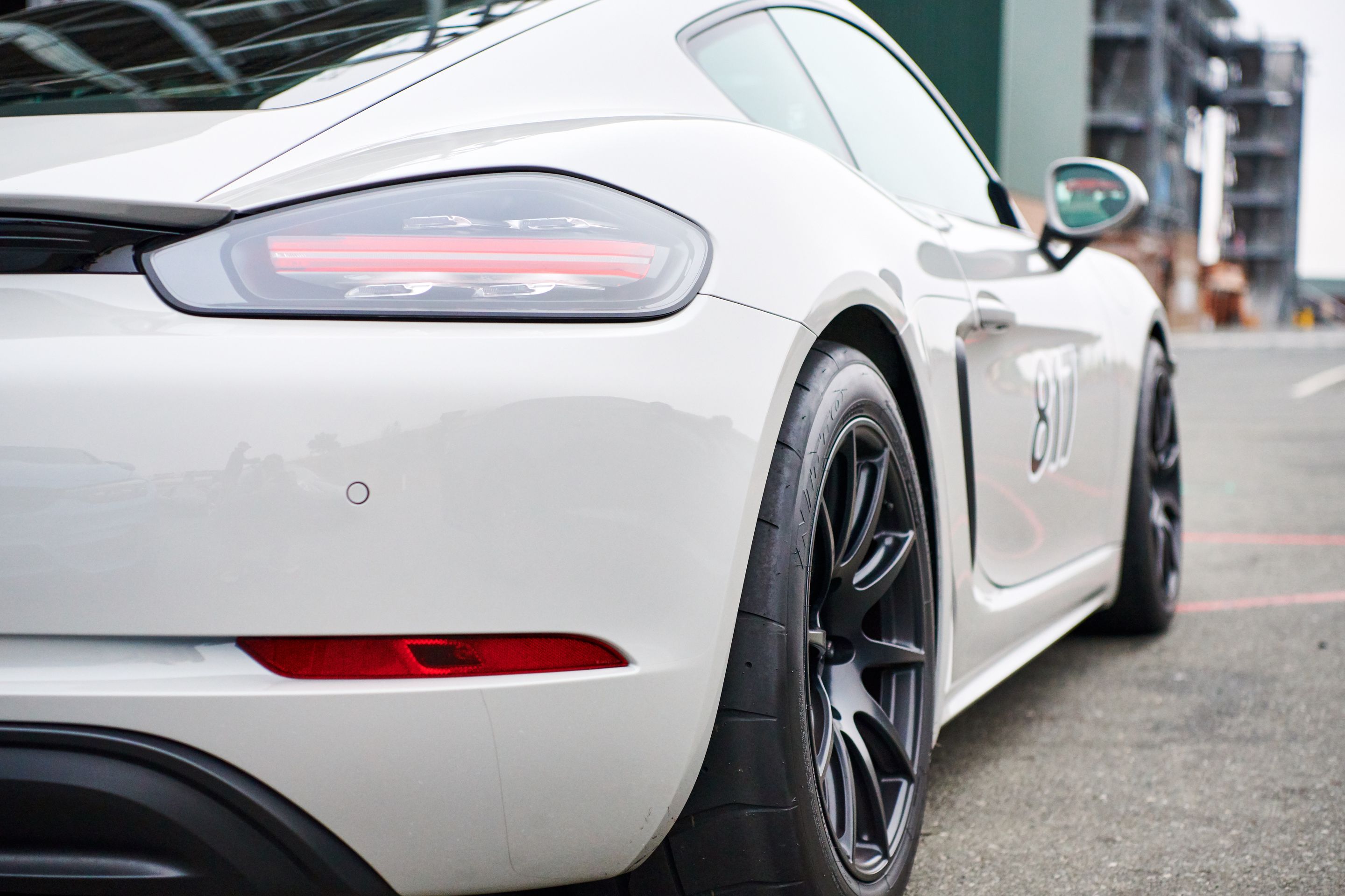 White Porsche 718 Cayman S with 18" SM-10 Apex wheels in Satin Black