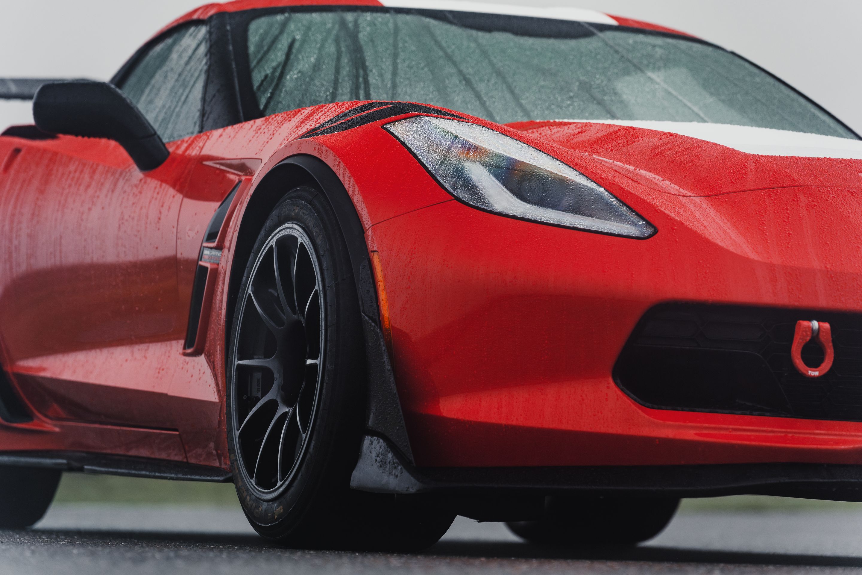 Red Chevrolet C7 Corvette Grand Sport with 18" SM-10RE Apex wheels in Satin Black