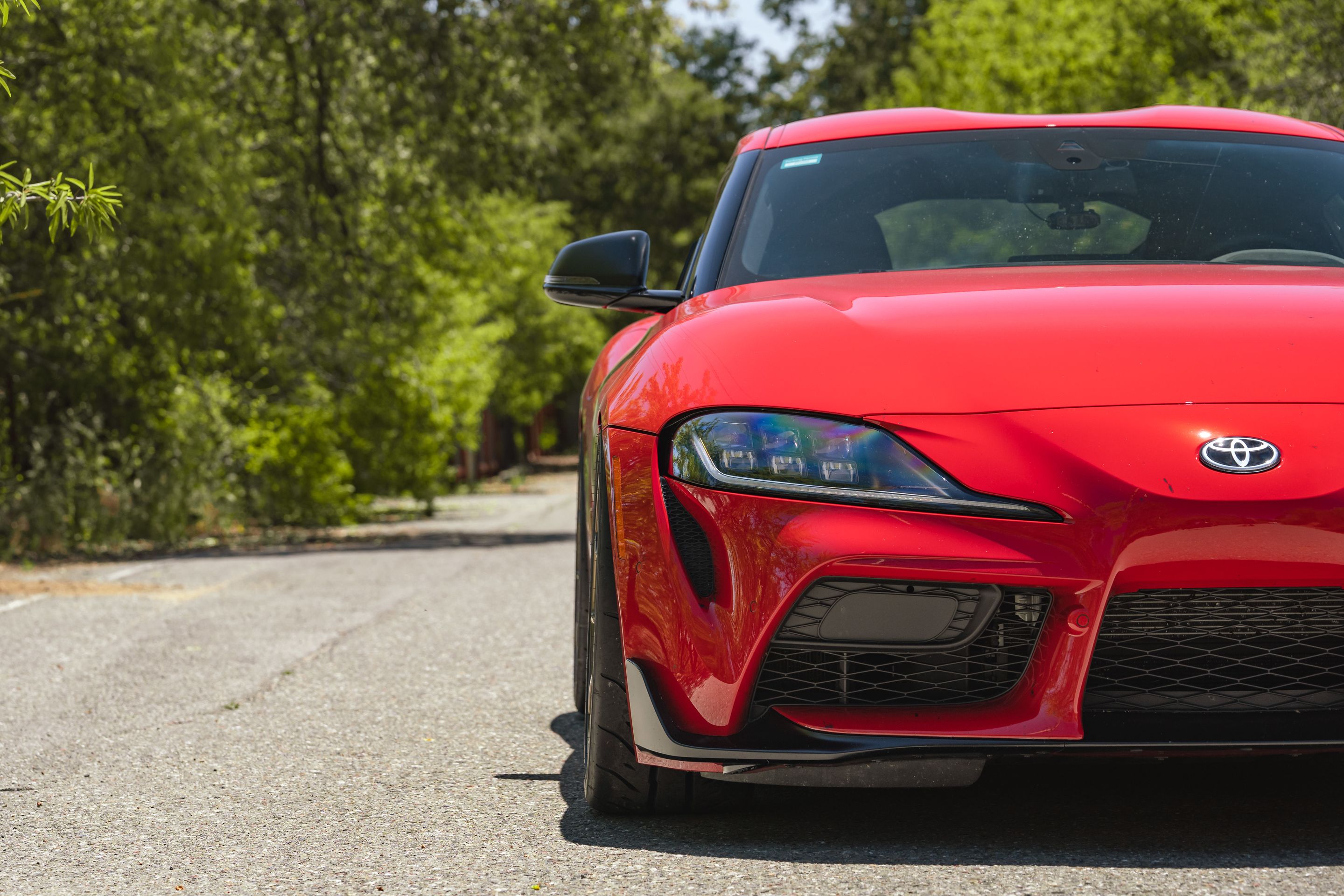 Red Toyota GR Supra with 19" VS-5RS Apex wheels in Satin Bronze
