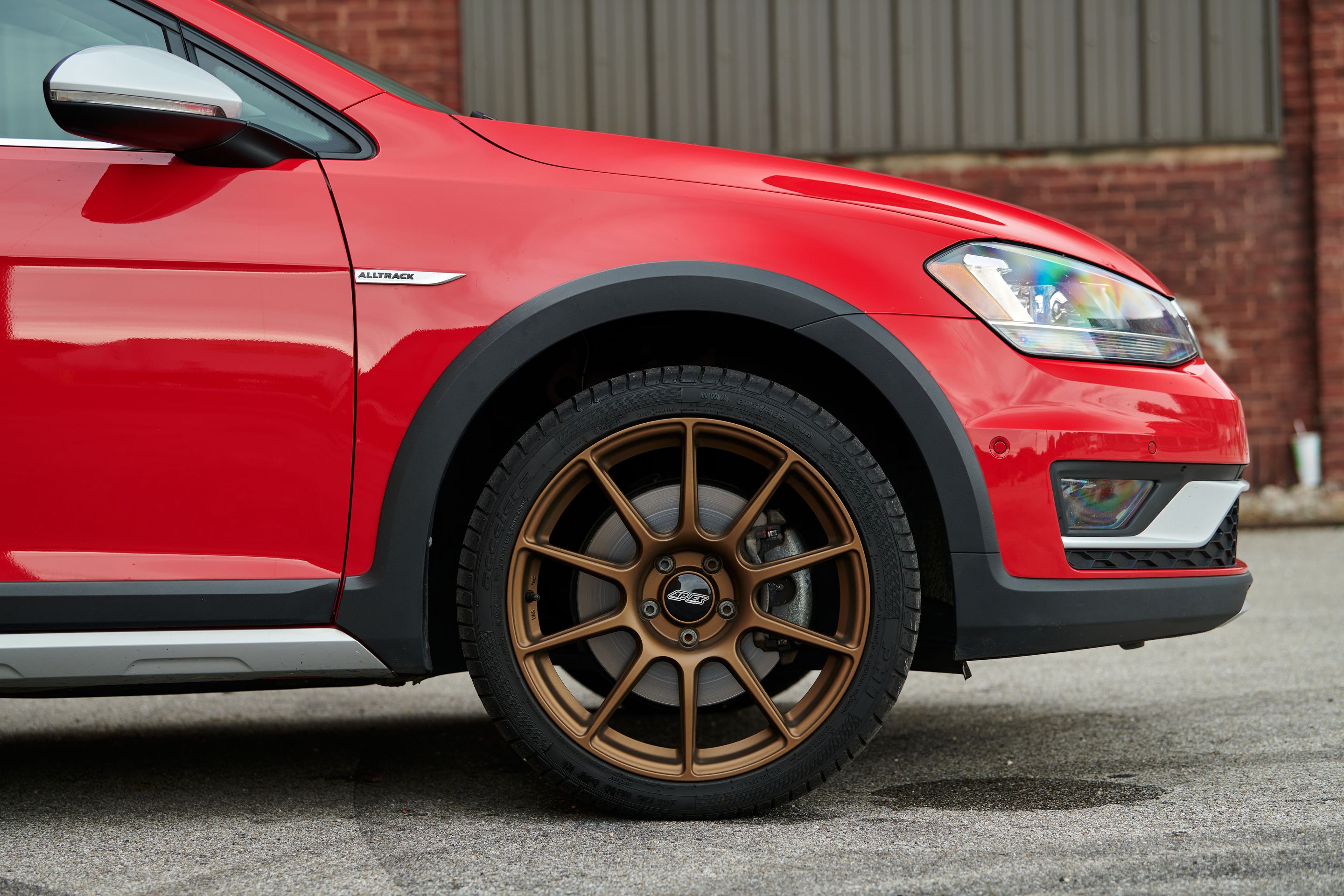 Red VW MK7 Alltrack/SportWagen Alltrack with 18" SM-10 Apex wheels in Satin Bronze