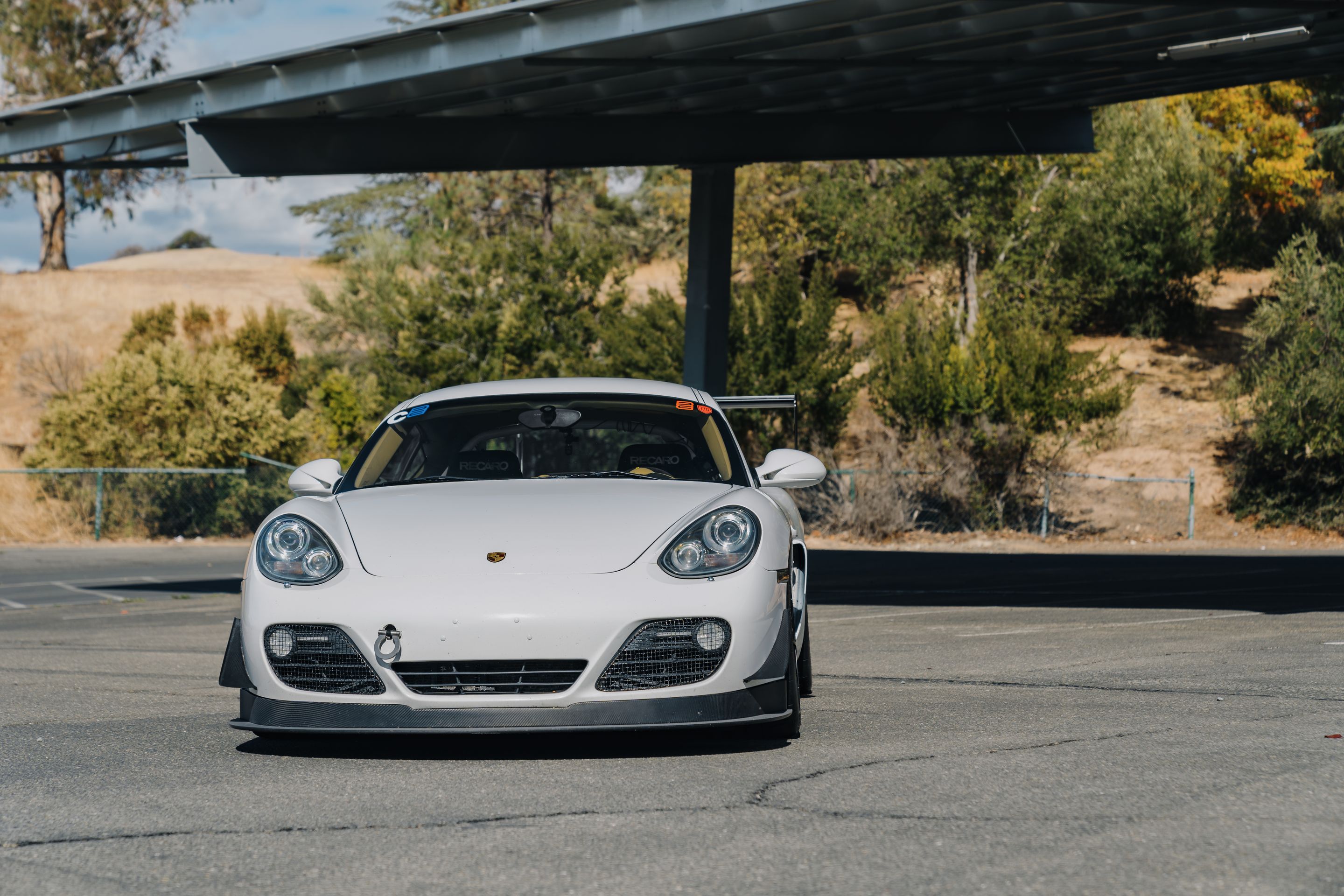White Porsche 987 Cayman S with 18" SM-10RS Apex wheels in Satin Black