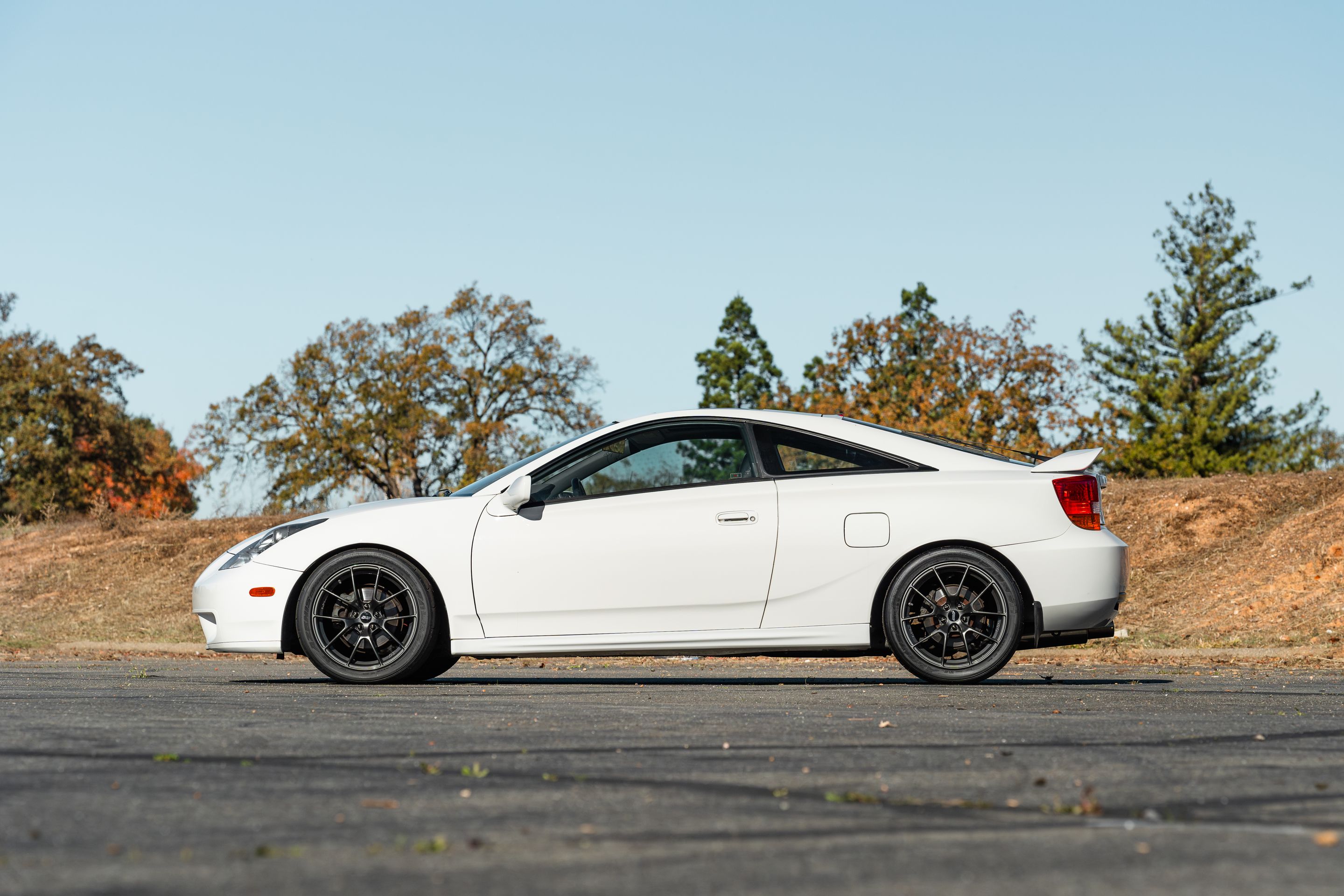 White Toyota 7th Gen Celica with 17" VS-5RS Apex wheels in Anthracite