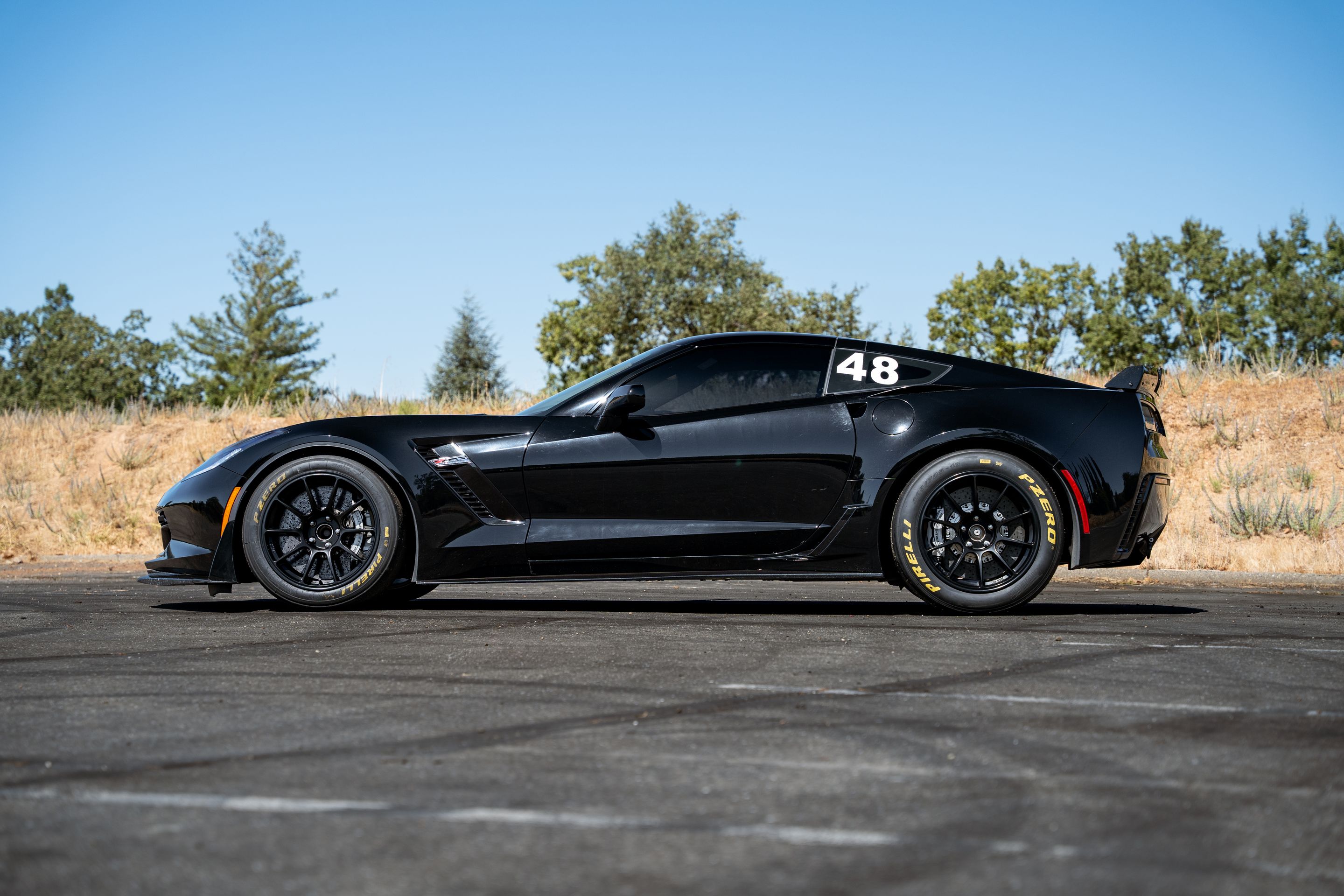 Black Chevrolet C7 Corvette Z06 with 18" SM-10RE Apex wheels in Satin Black