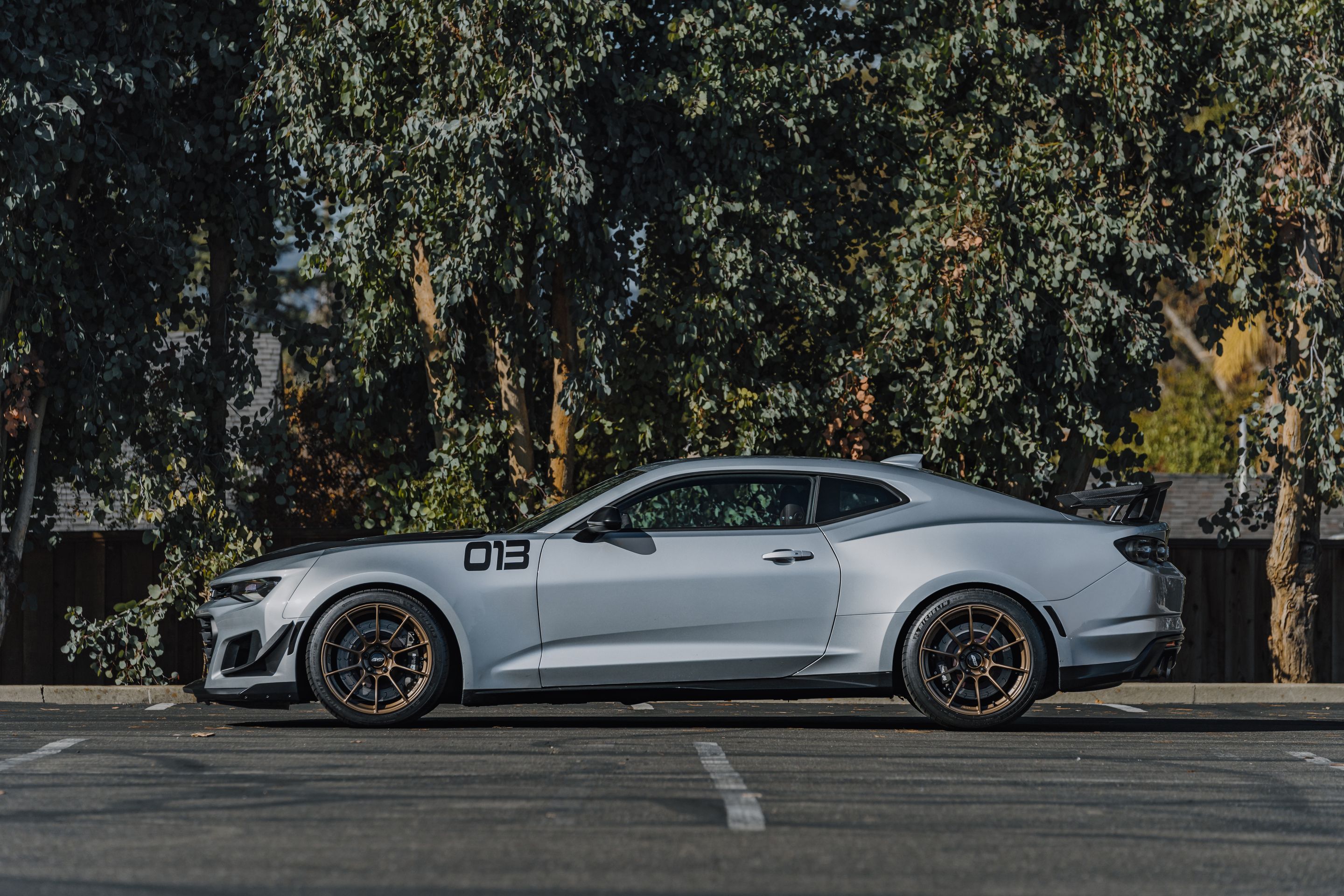 Silver Chevrolet 6th Gen Camaro ZL1 1LE with 19" SM-10RS Apex wheels in Satin Bronze