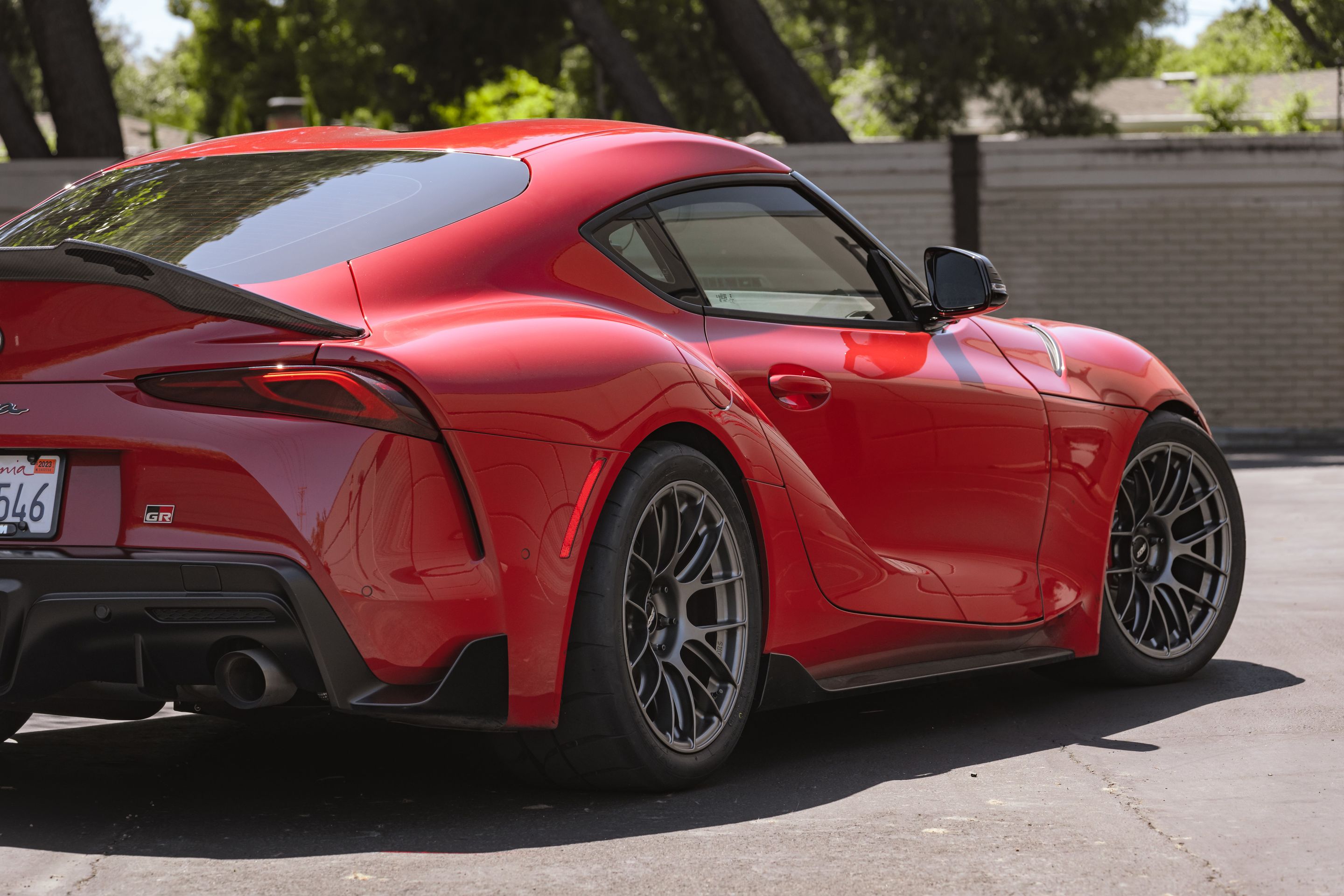 Red Toyota GR Supra with 18" EC-7RS Apex wheels in Anthracite