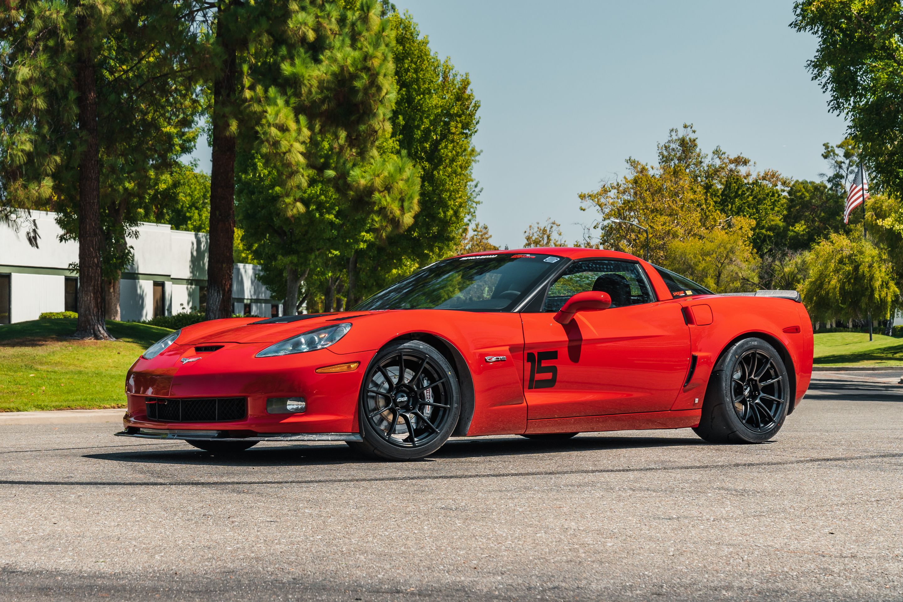 Red Chevrolet C6 Corvette Z06 with 18" SM-10RS Apex wheels in Satin Black