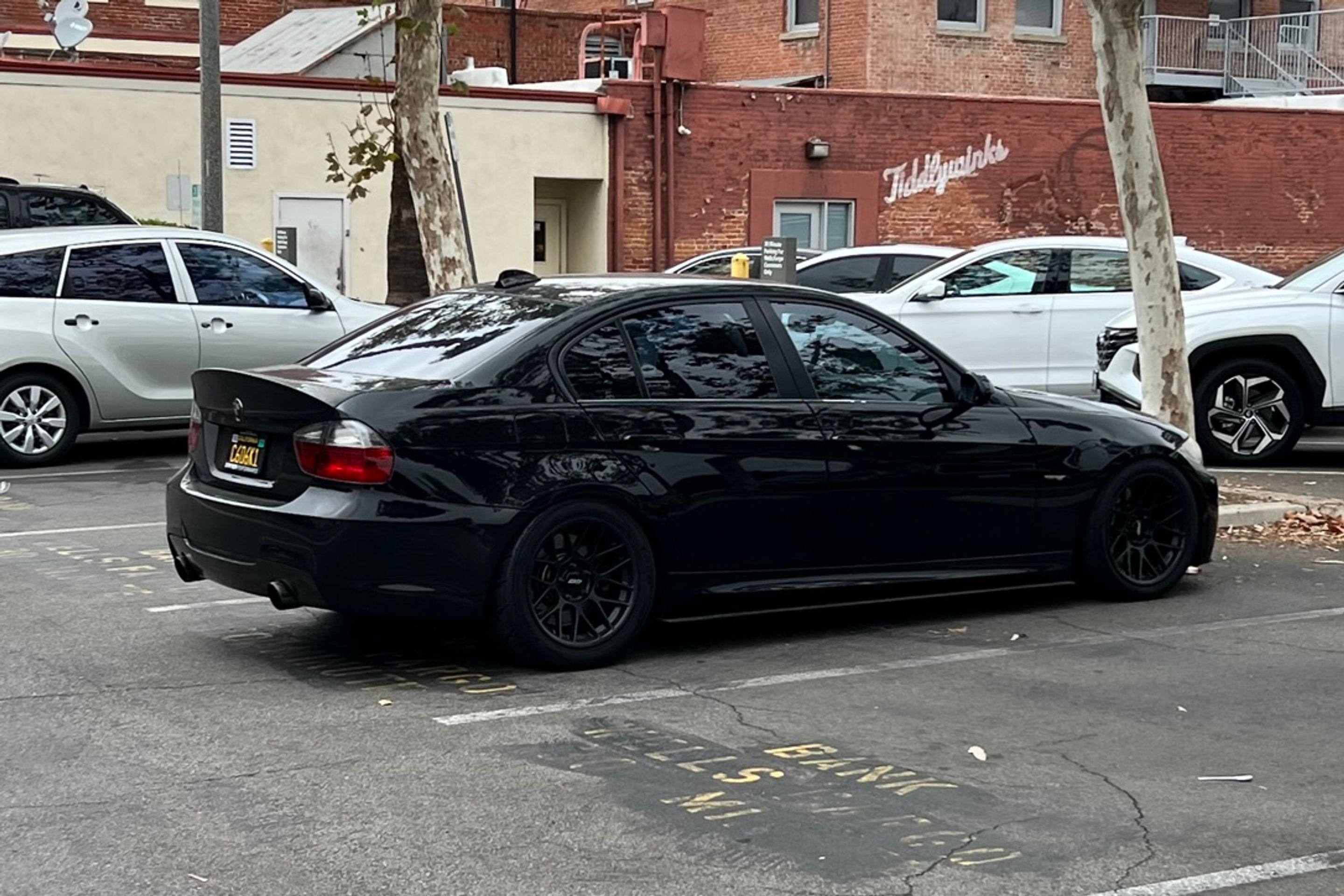 Black BMW E90 Sedan 3 Series with 17" ARC-8 Apex wheels in Satin Black