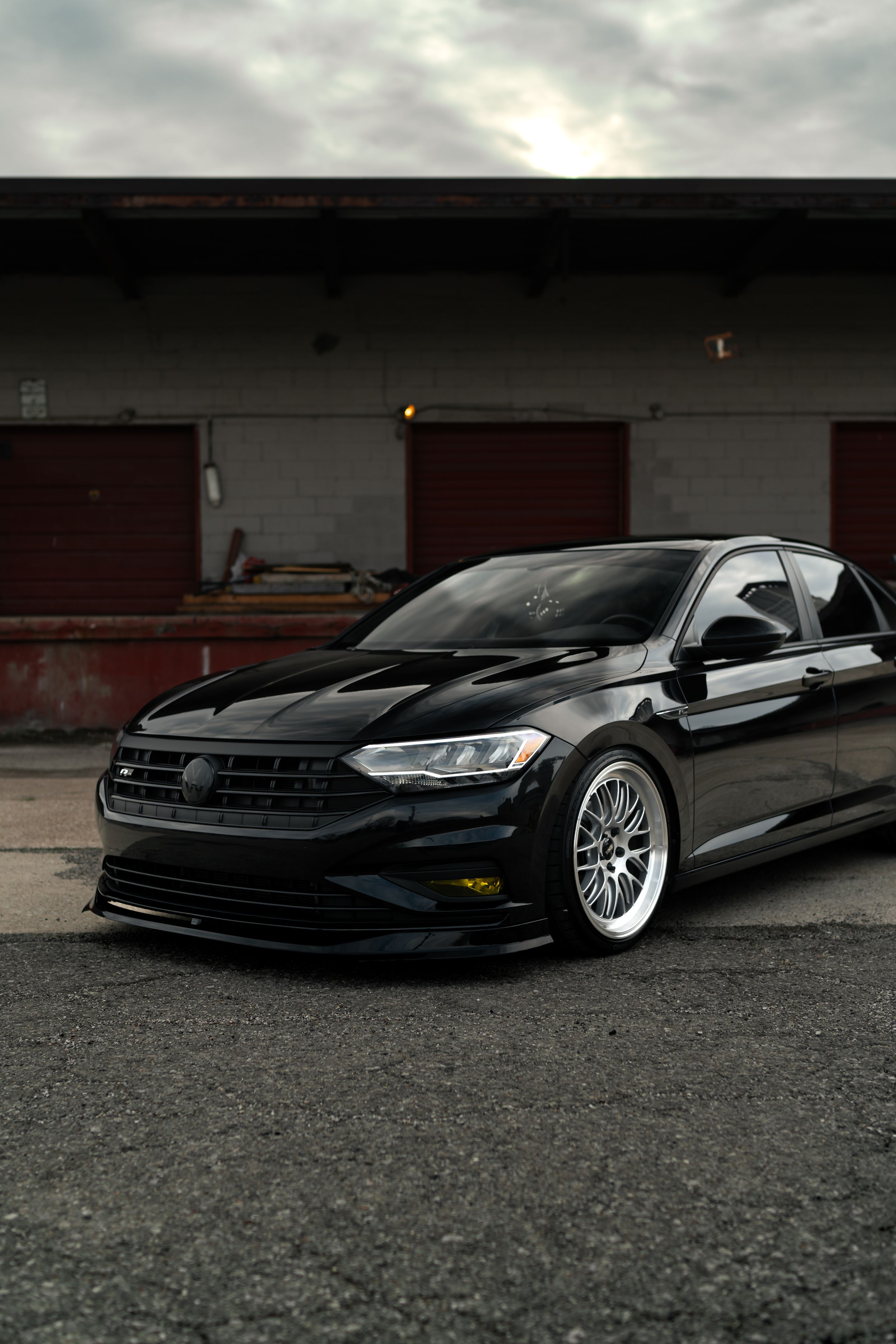 Black VW MK7 Jetta with 19" ML-10RT Apex wheels in Machined Lip Race Silver