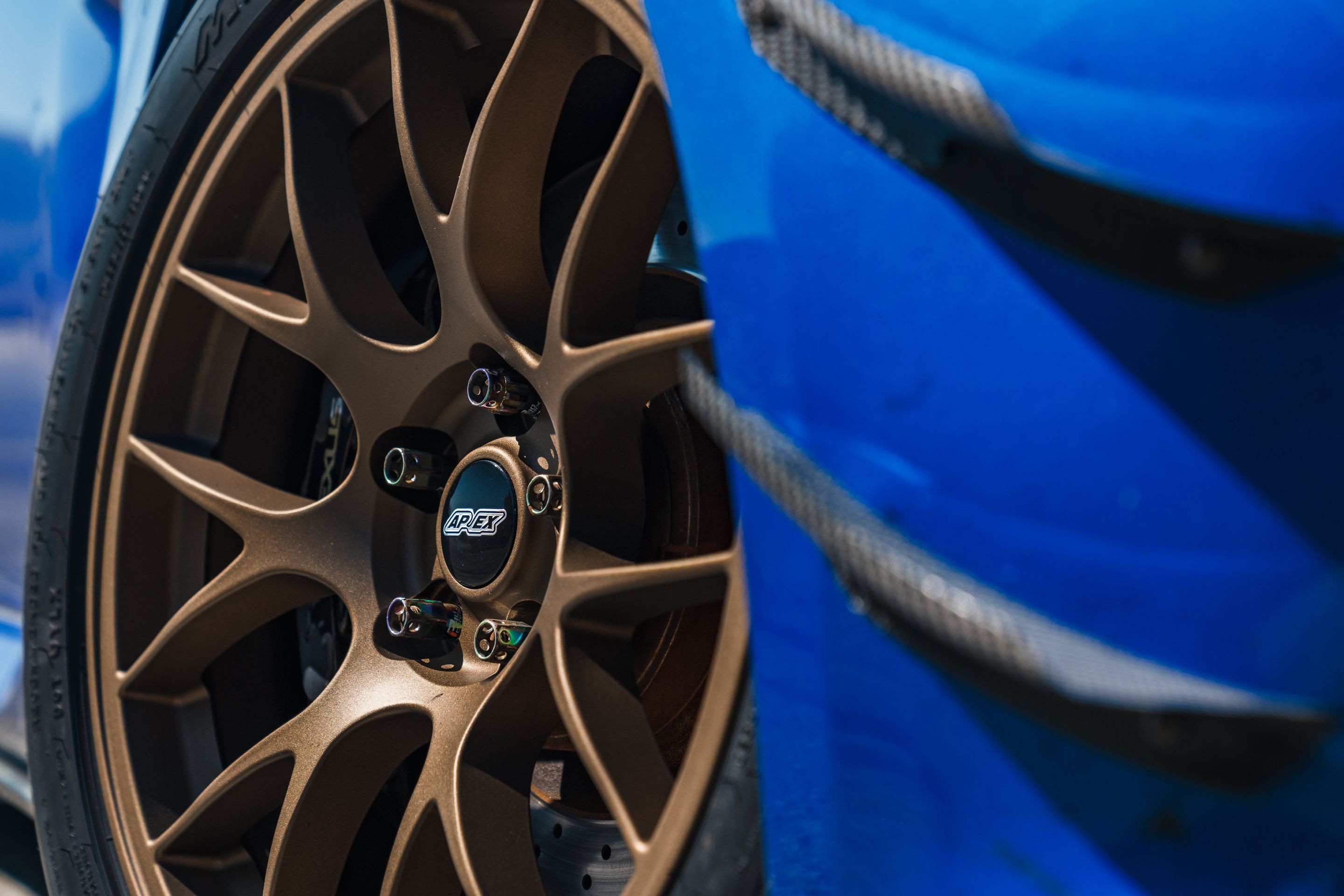 Blue Lexus USE20 IS-F with 18" EC-7 Apex wheels in Satin Bronze