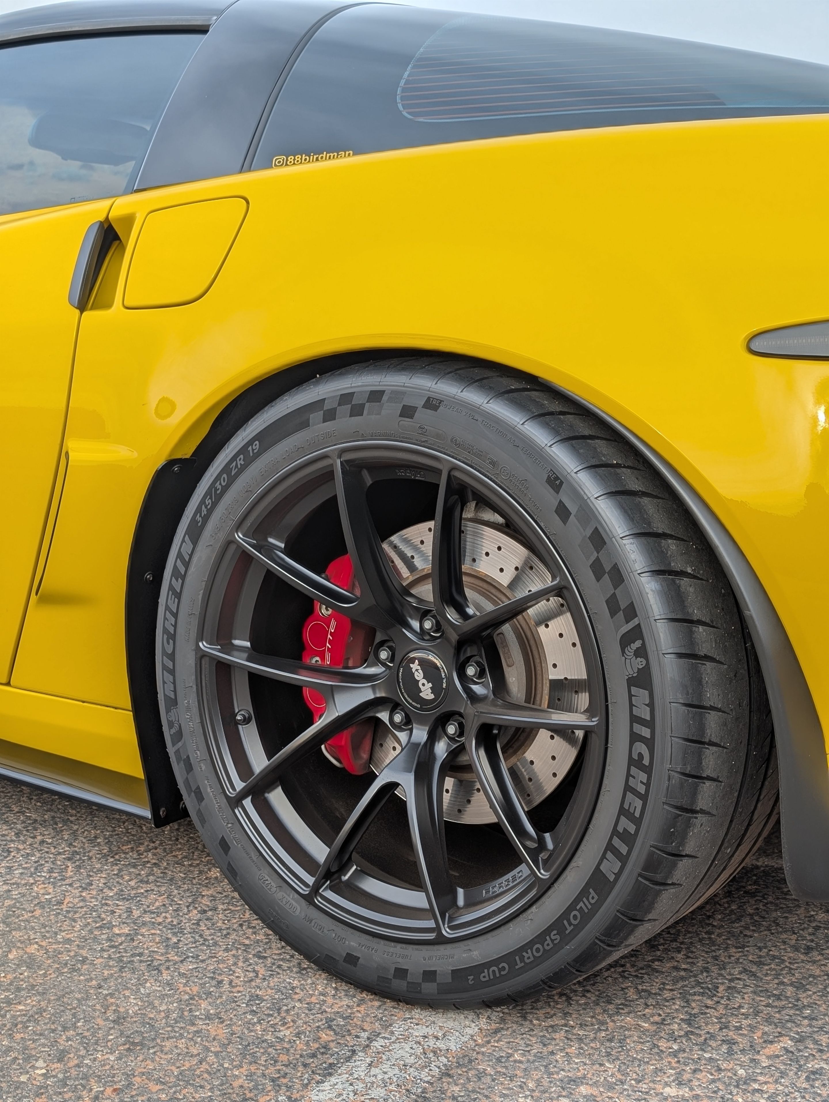 Yellow Chevrolet C6 Corvette Z06 with 19" VS-5RS Apex wheels in Satin Black