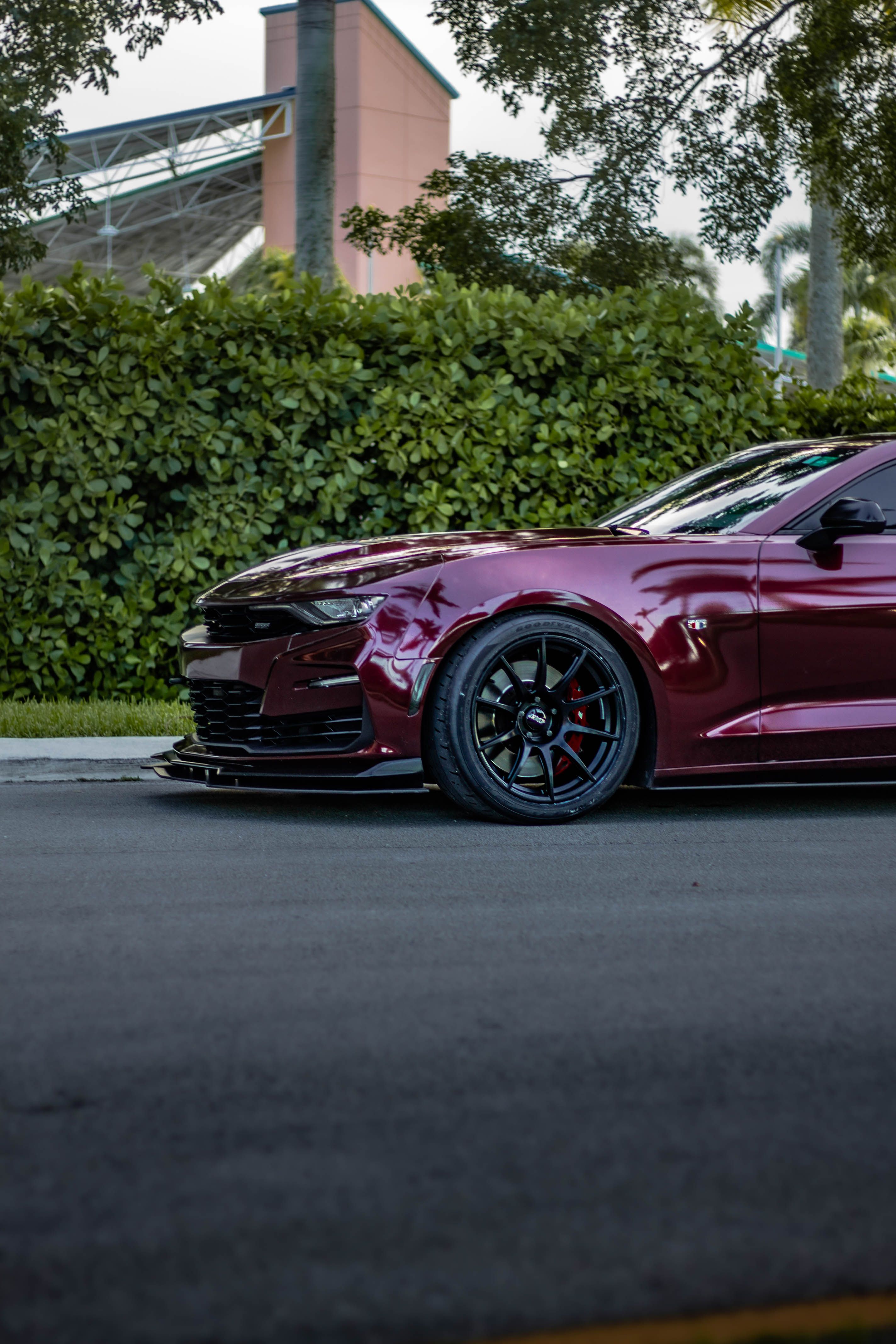 Red Chevrolet 6th Gen Camaro SS with 19" SM-10 Apex wheels in Satin Black