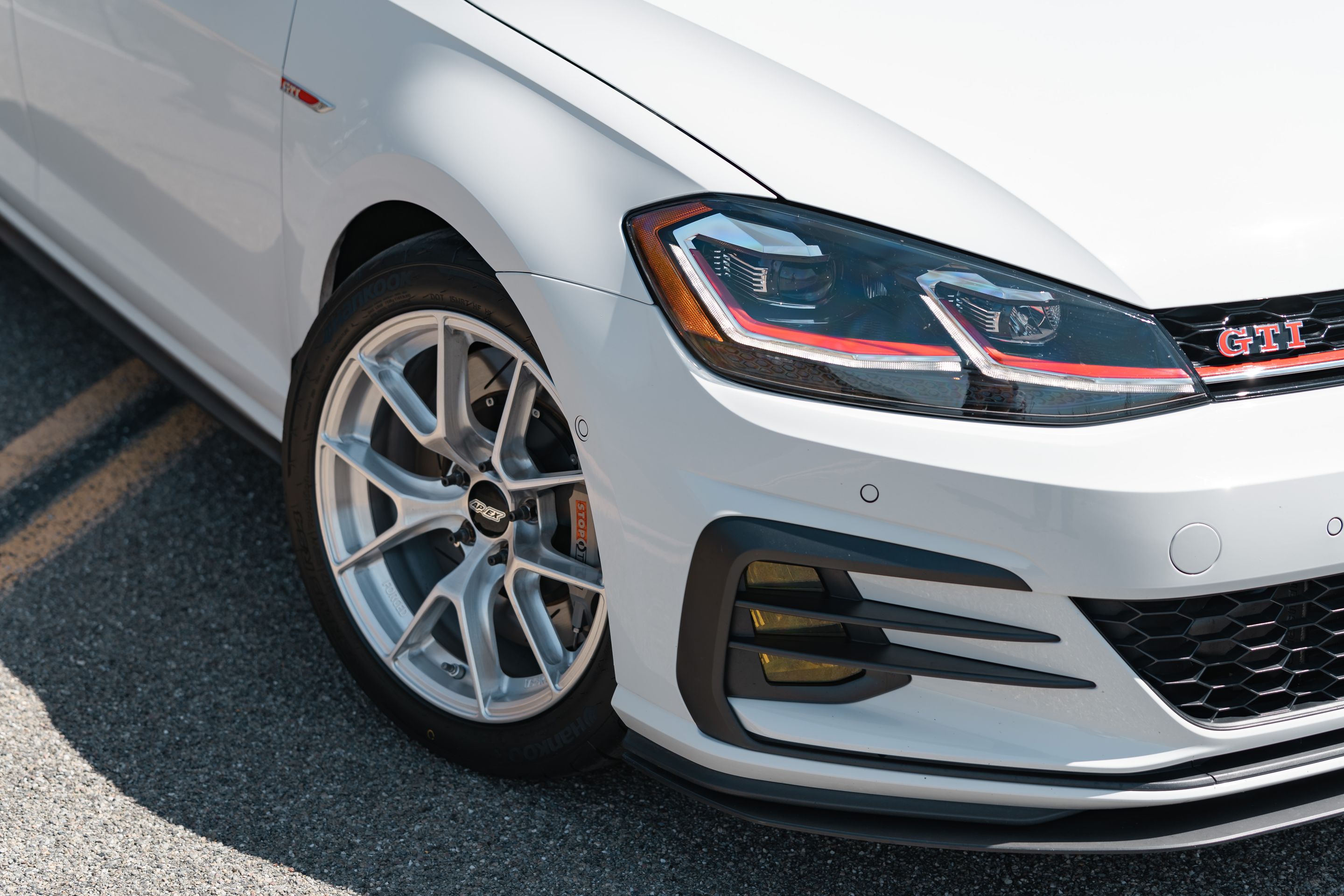 White VW MK7 GTI with 17" VS-5RS Apex wheels in Brushed Clear