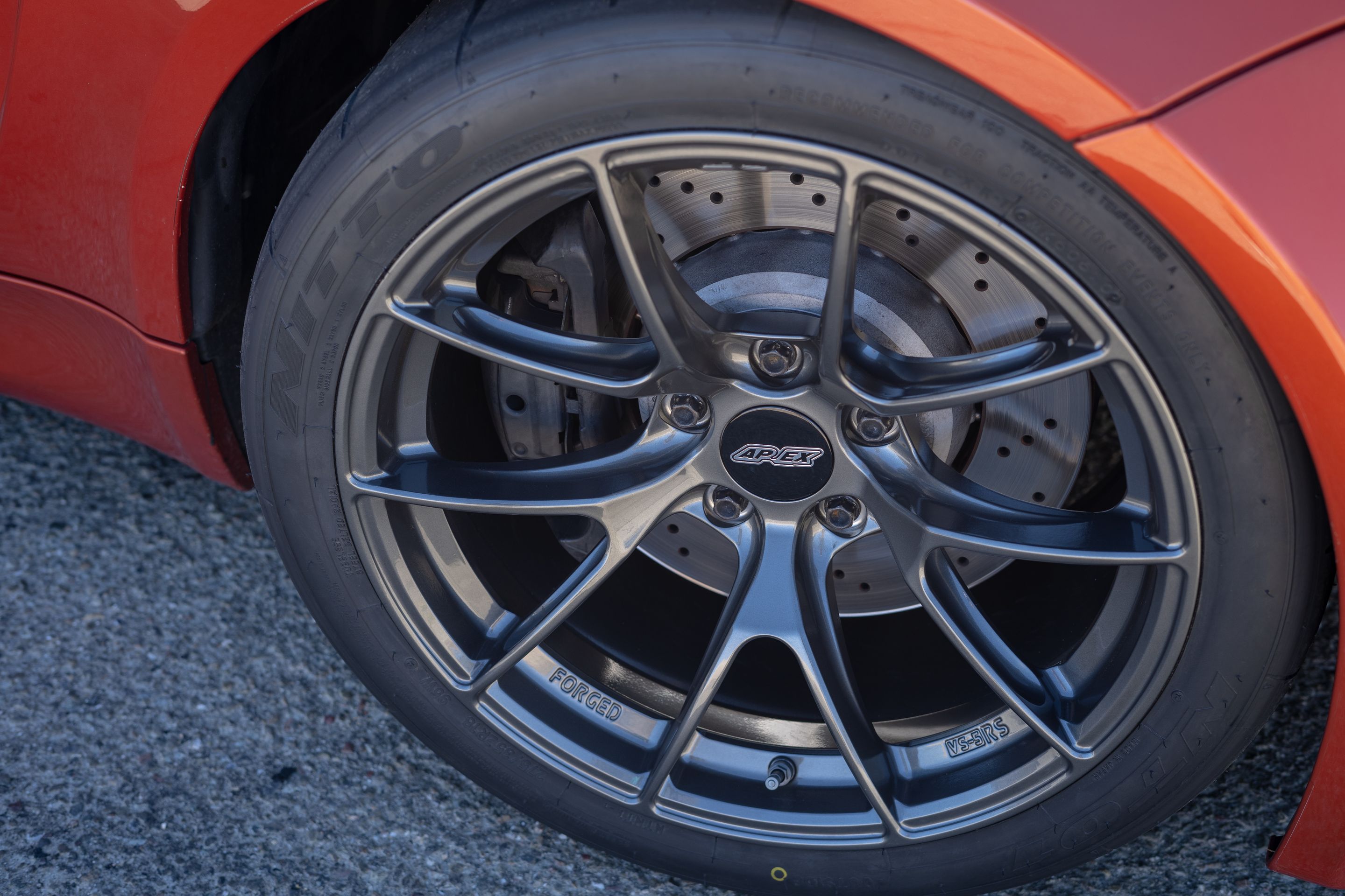Orange BMW E82 1M with 18" VS-5RS Apex wheels in Anthracite