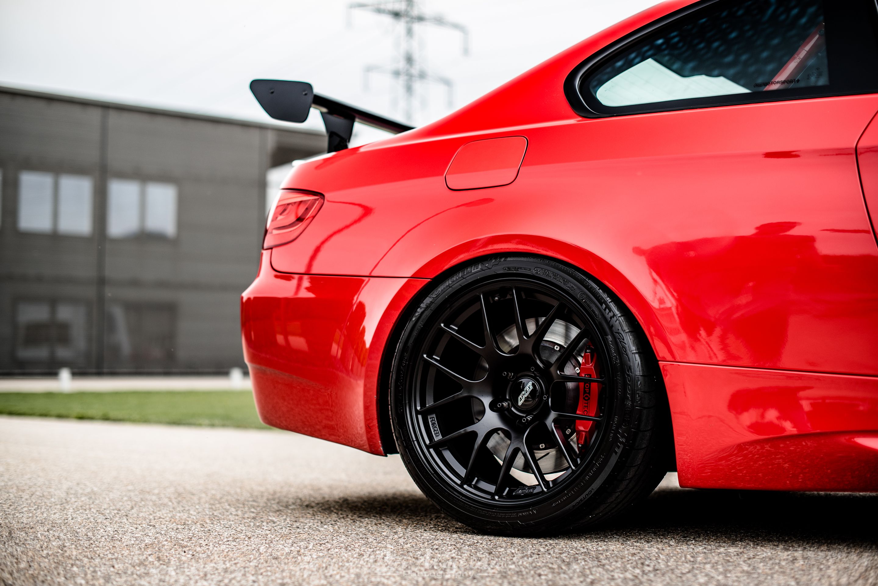 Red BMW E92 Coupe M3 with 18" EC-7R Apex wheels in Satin Black
