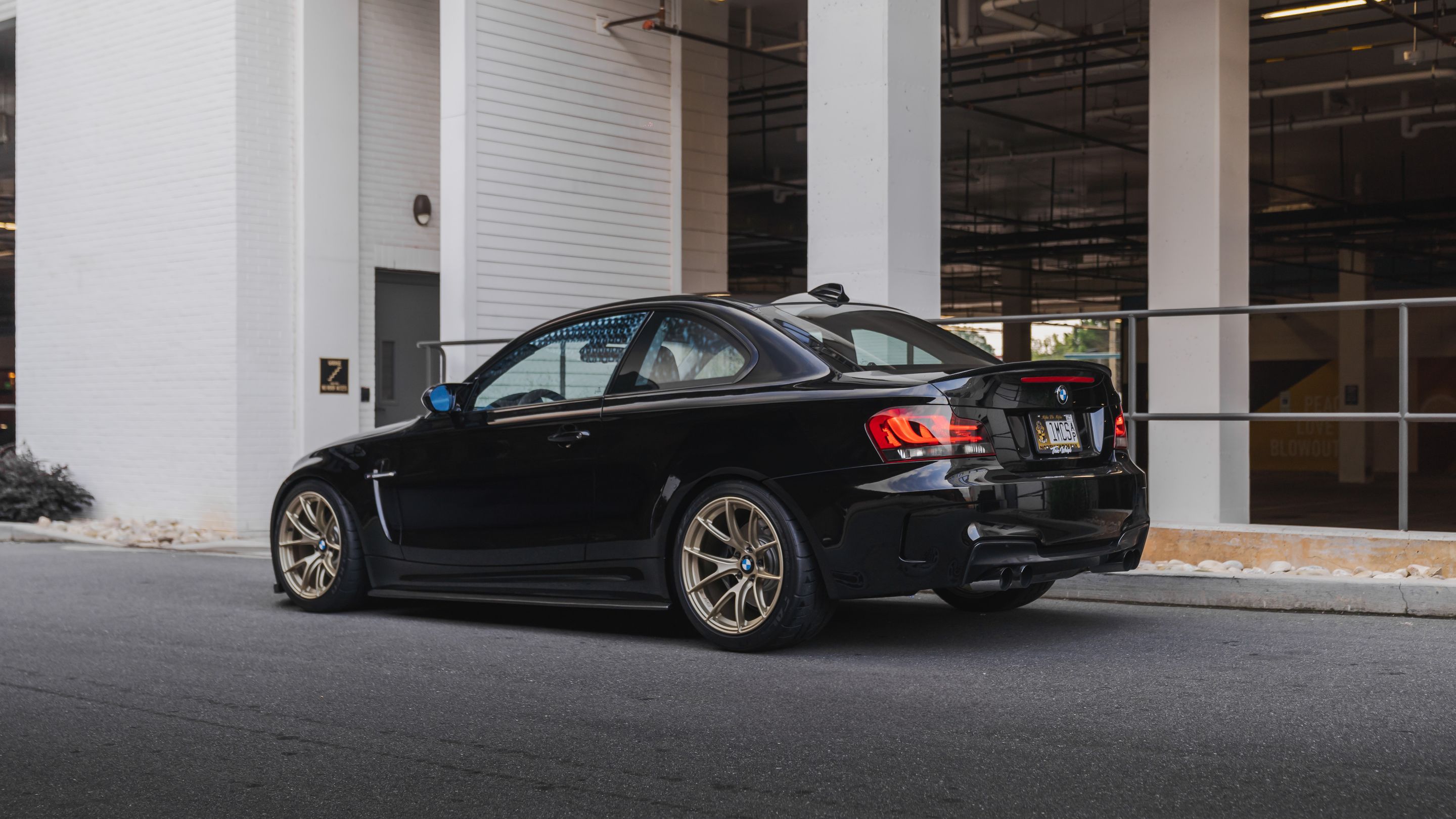 Black BMW E82 Coupe 1 Series with 18" VS-5RS Apex wheels in Motorsport Gold