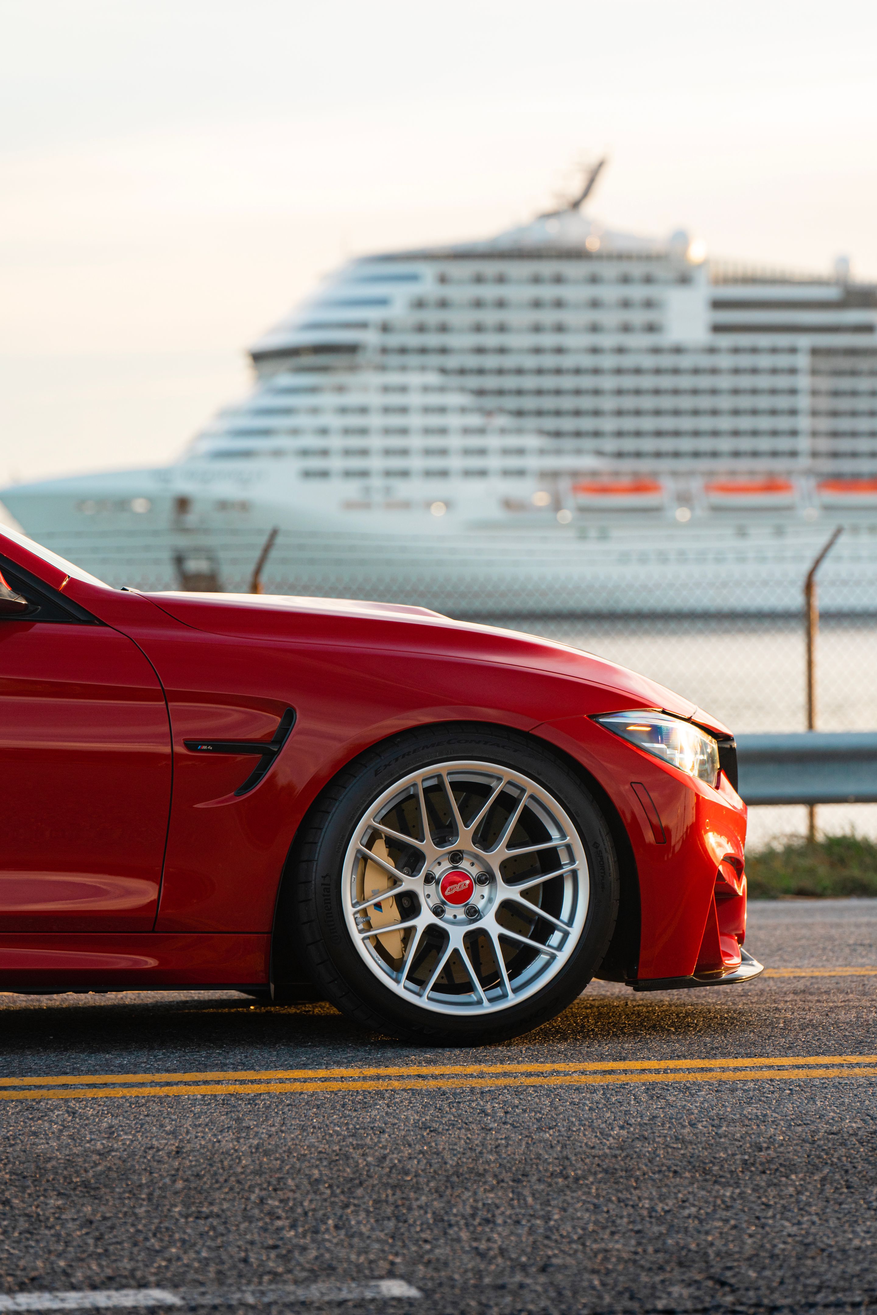 Red BMW F82 Coupe M4 with 19" ARC-8 Apex wheels in Hyper Silver