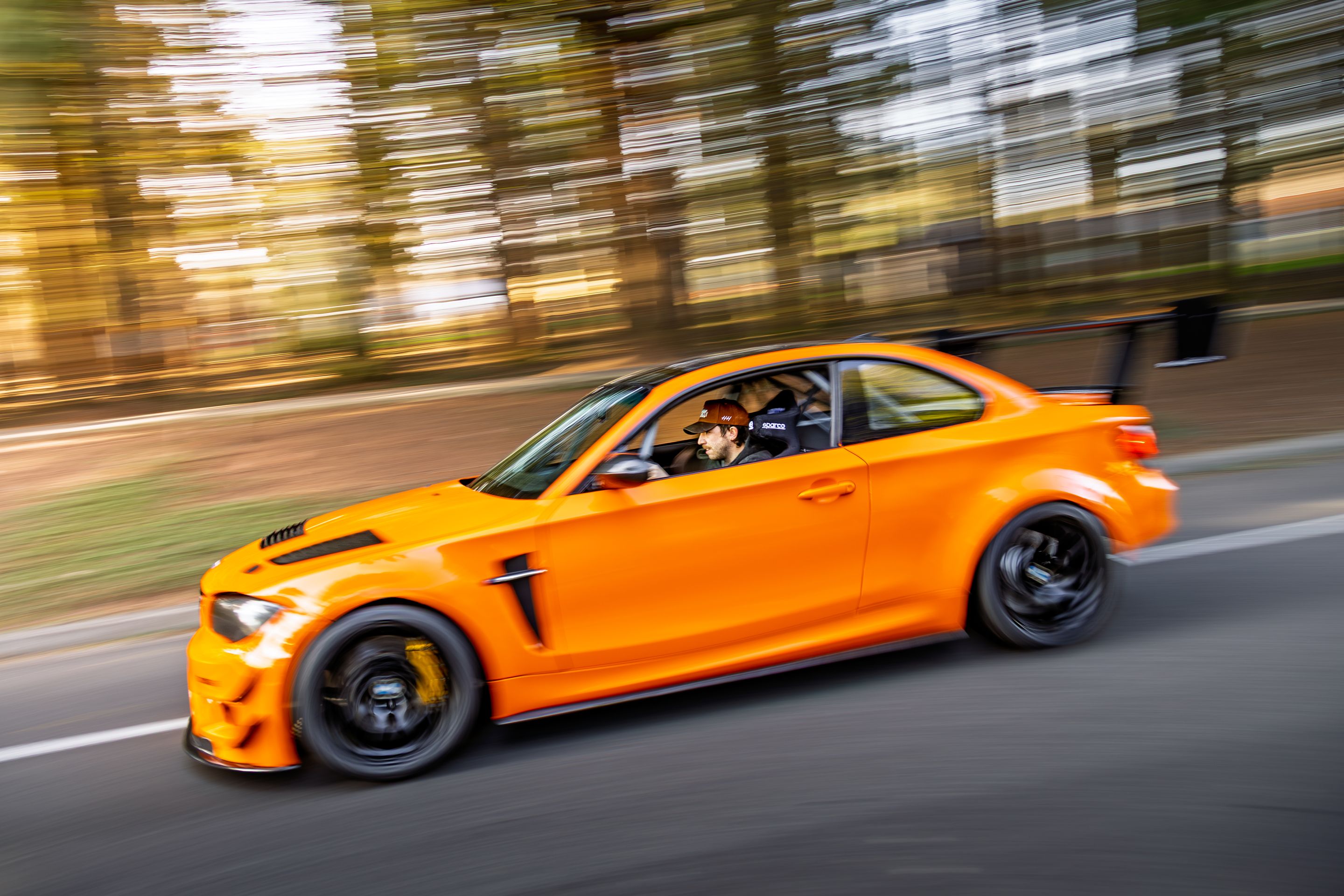 Orange BMW E82 1M with 18" EC-7 Apex wheels in Satin Black