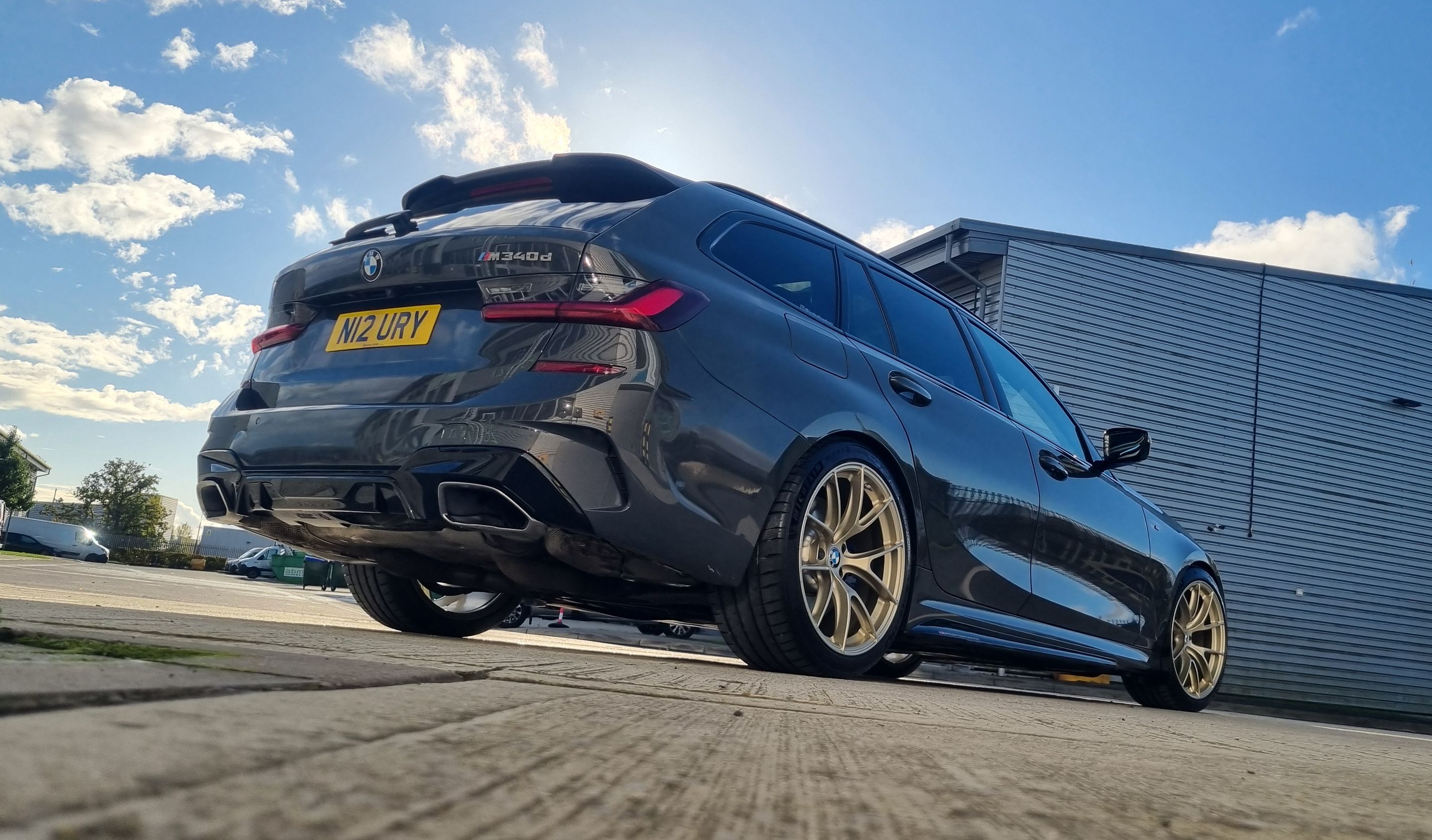 Black BMW G21 Wagon 3 Series with 19" VS-5RS Apex wheels in Motorsport Gold