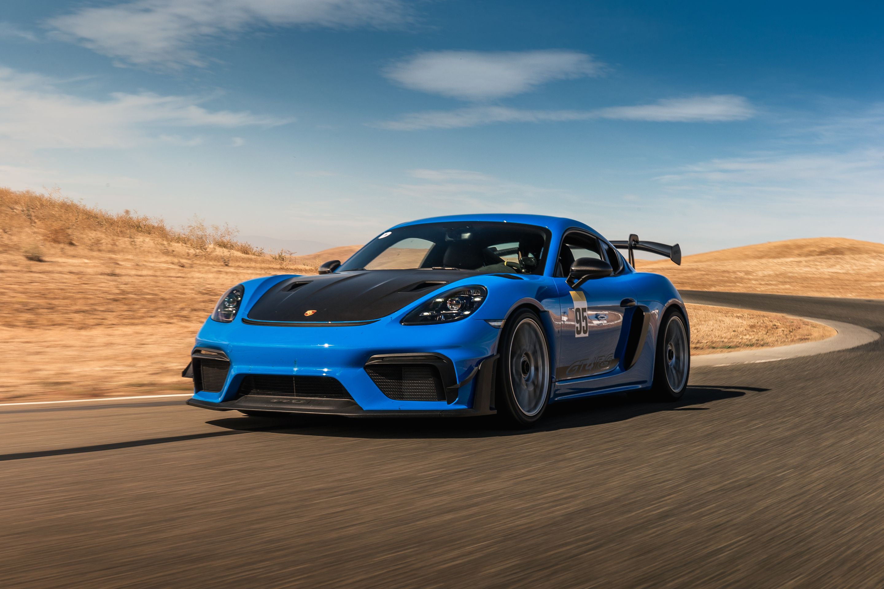 Blue Porsche 718 Cayman GT4 RS with 19" EC-7RS Apex wheels in Race Silver