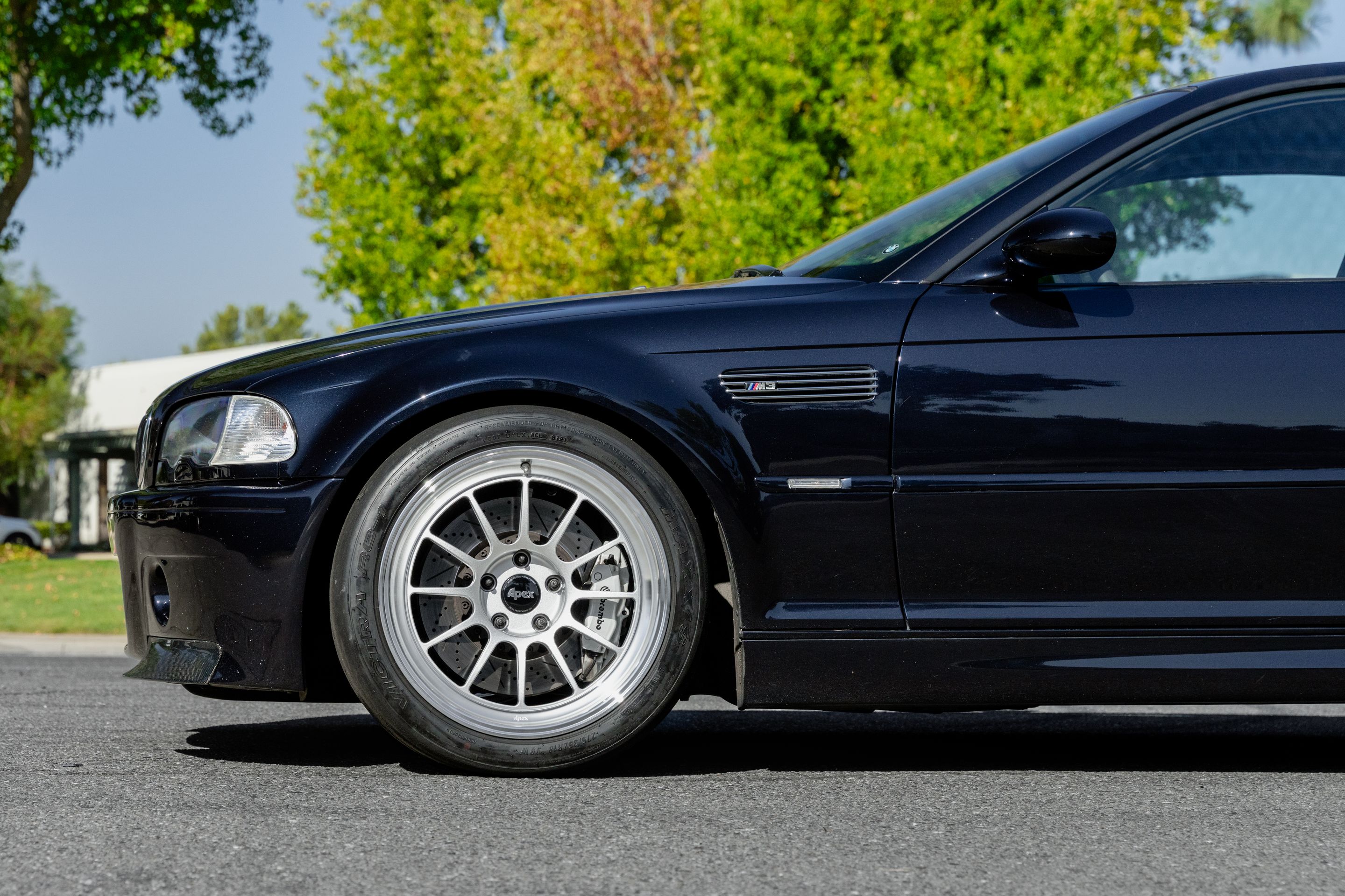 Black BMW E46 M3 with 18" SL-12 Apex wheels in Machined Lip Race Silver