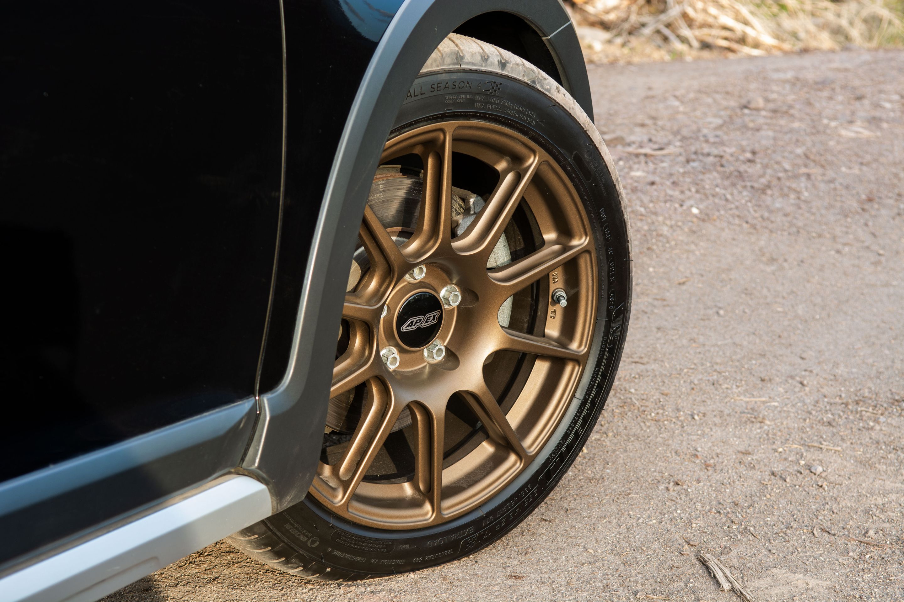 Black VW MK7 Alltrack/SportWagen Golf SportWagen with 17" SM-10 Apex wheels in Satin Bronze