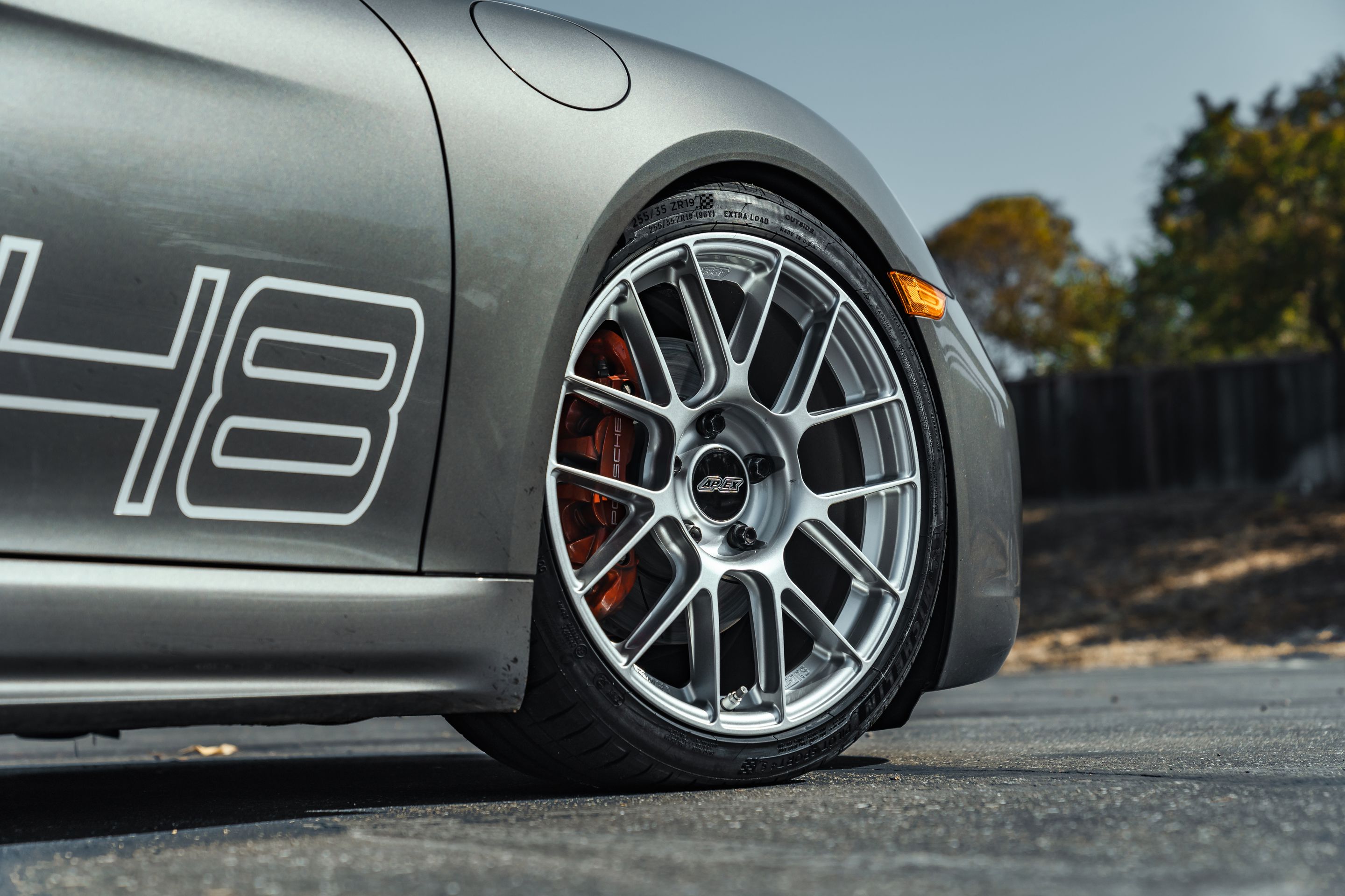 Grey Porsche 718 Cayman S with 19" EC-7RS Apex wheels in Race Silver