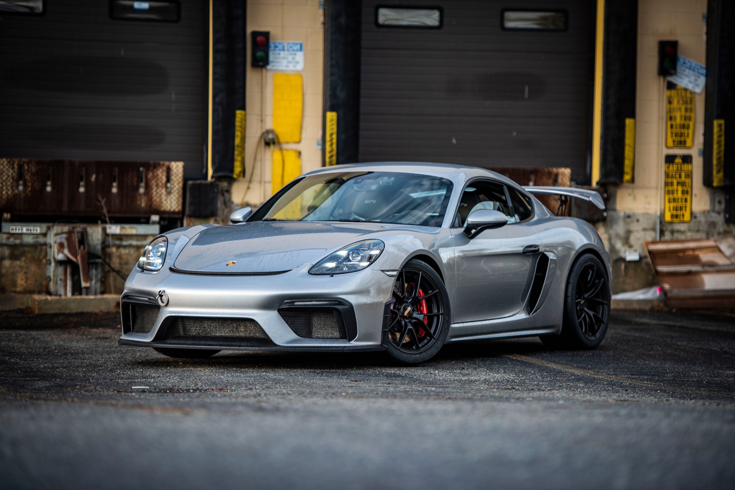Silver Porsche 718 Cayman GT4 with 19" VS-5RS Apex wheels in Satin Black