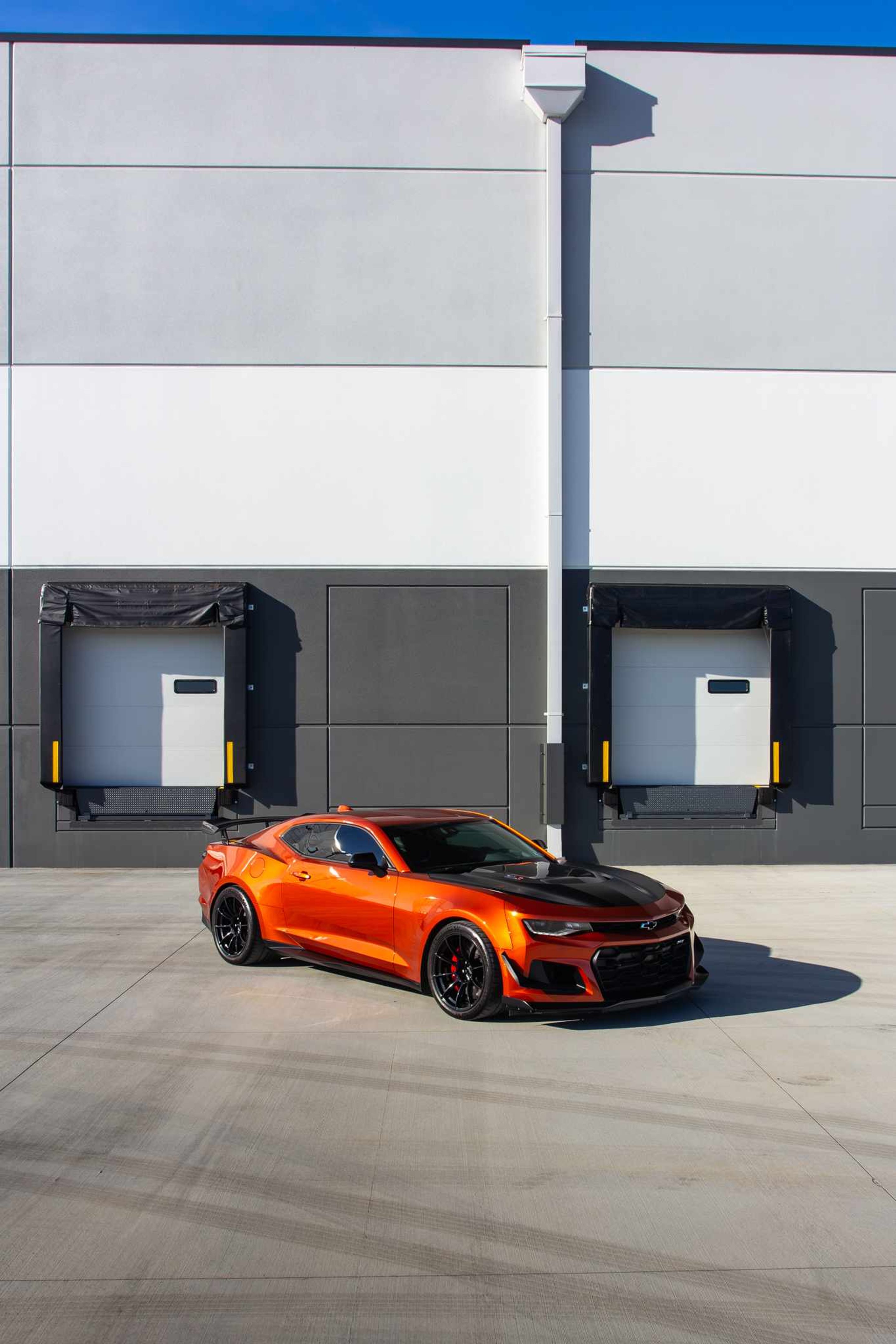 Red Chevrolet 6th Gen Camaro ZL1 1LE with 19" SM-10RS Apex wheels in Satin Black