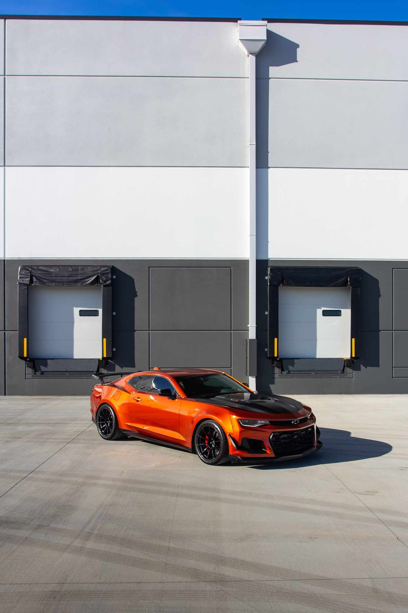 Red Chevrolet 6th Gen Camaro ZL1 1LE with 19" SM-10RS Apex wheels in Satin Black