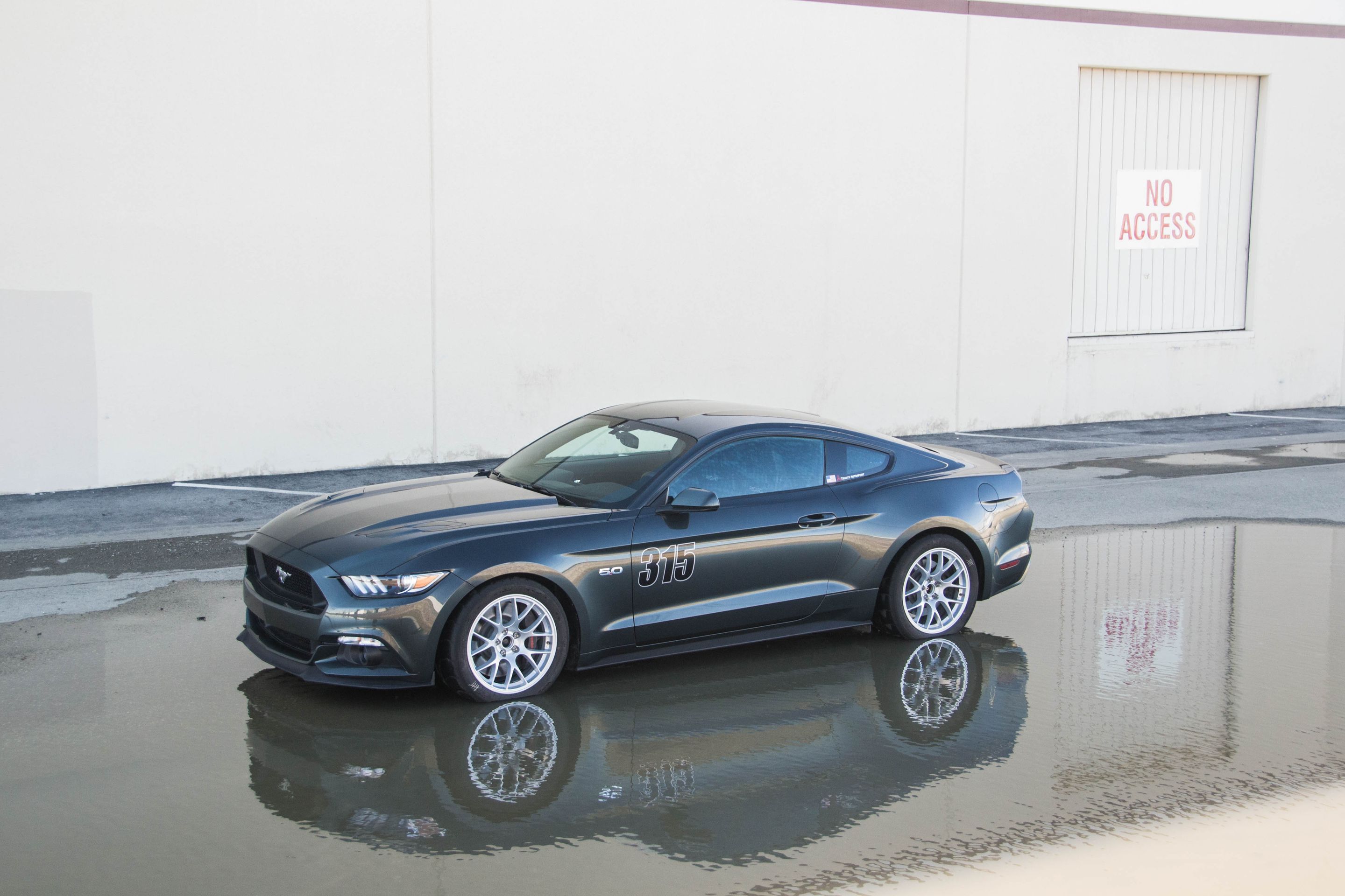 Green Ford S550 Mustang GT with 18" EC-7 Apex wheels in Race Silver