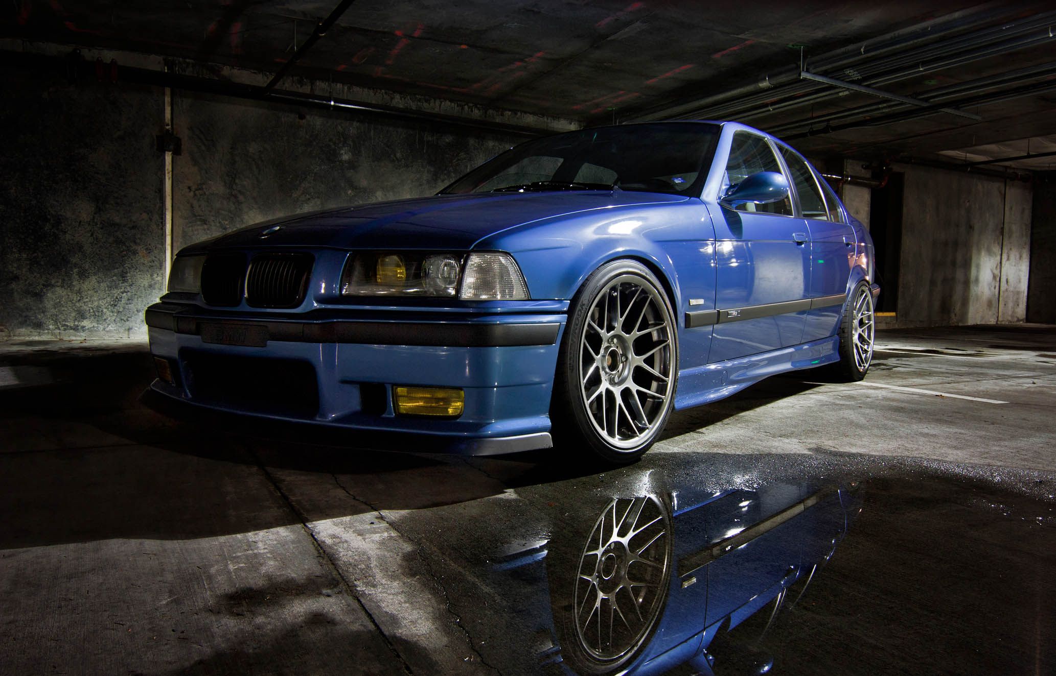 Blue BMW E36 M3 with 18" ARC-8 Apex wheels in Hyper Black