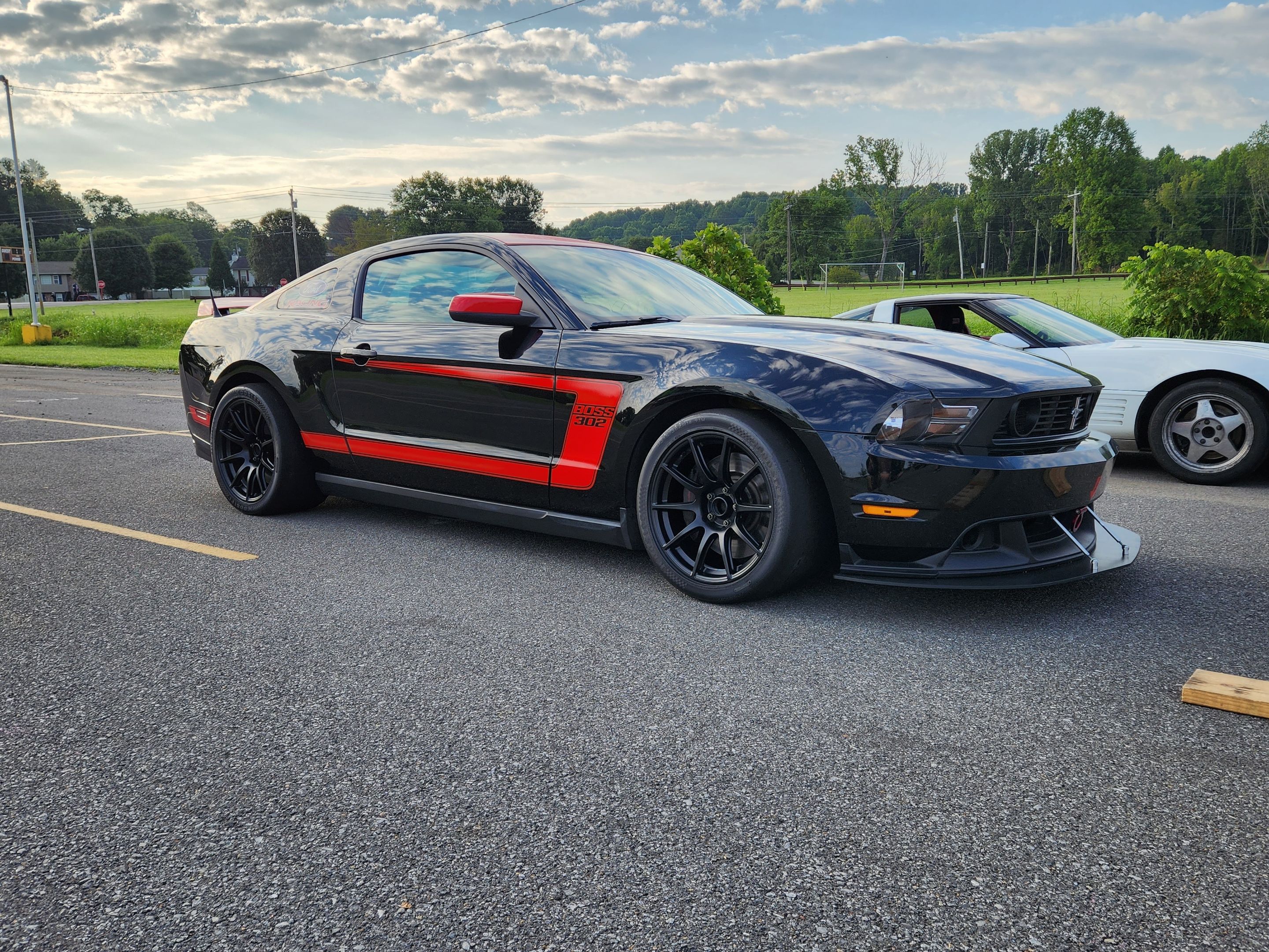 Black Ford S197 Mustang Boss 302 with 18" SM-10 Apex wheels in Satin Black
