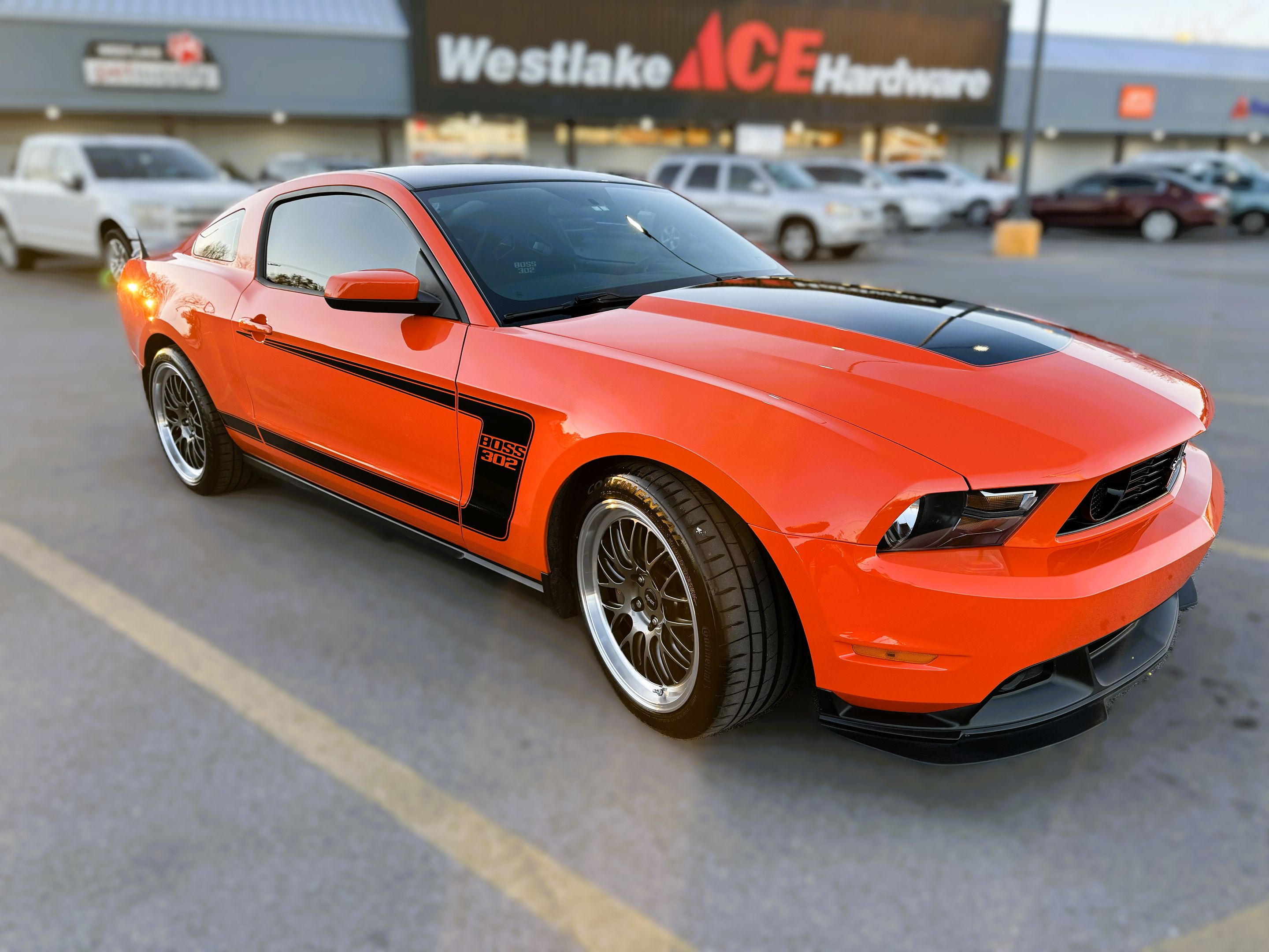 Orange Ford S197 Mustang Boss 302 with 19" ML-10RT Apex wheels in Machined Lip Anthracite