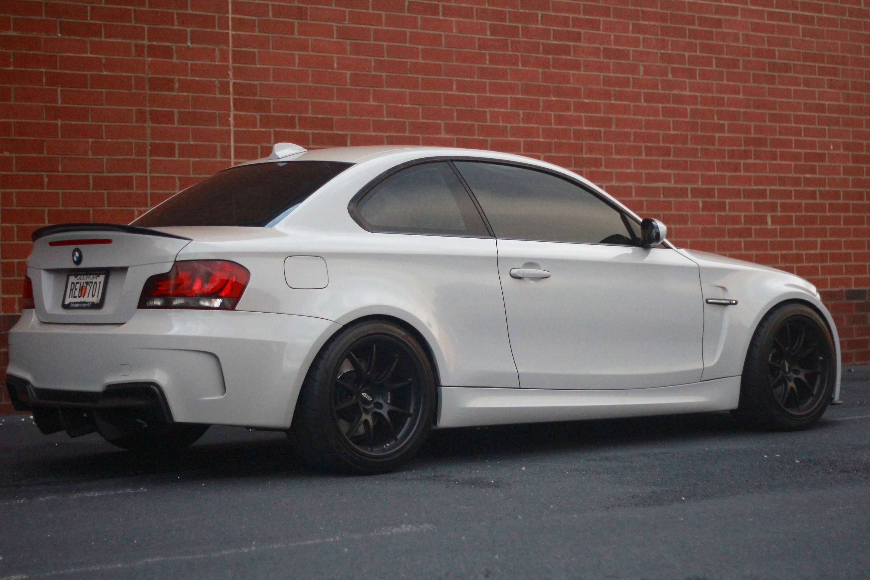 White BMW E82 1M with 18" FL-5 Apex wheels in Satin Black