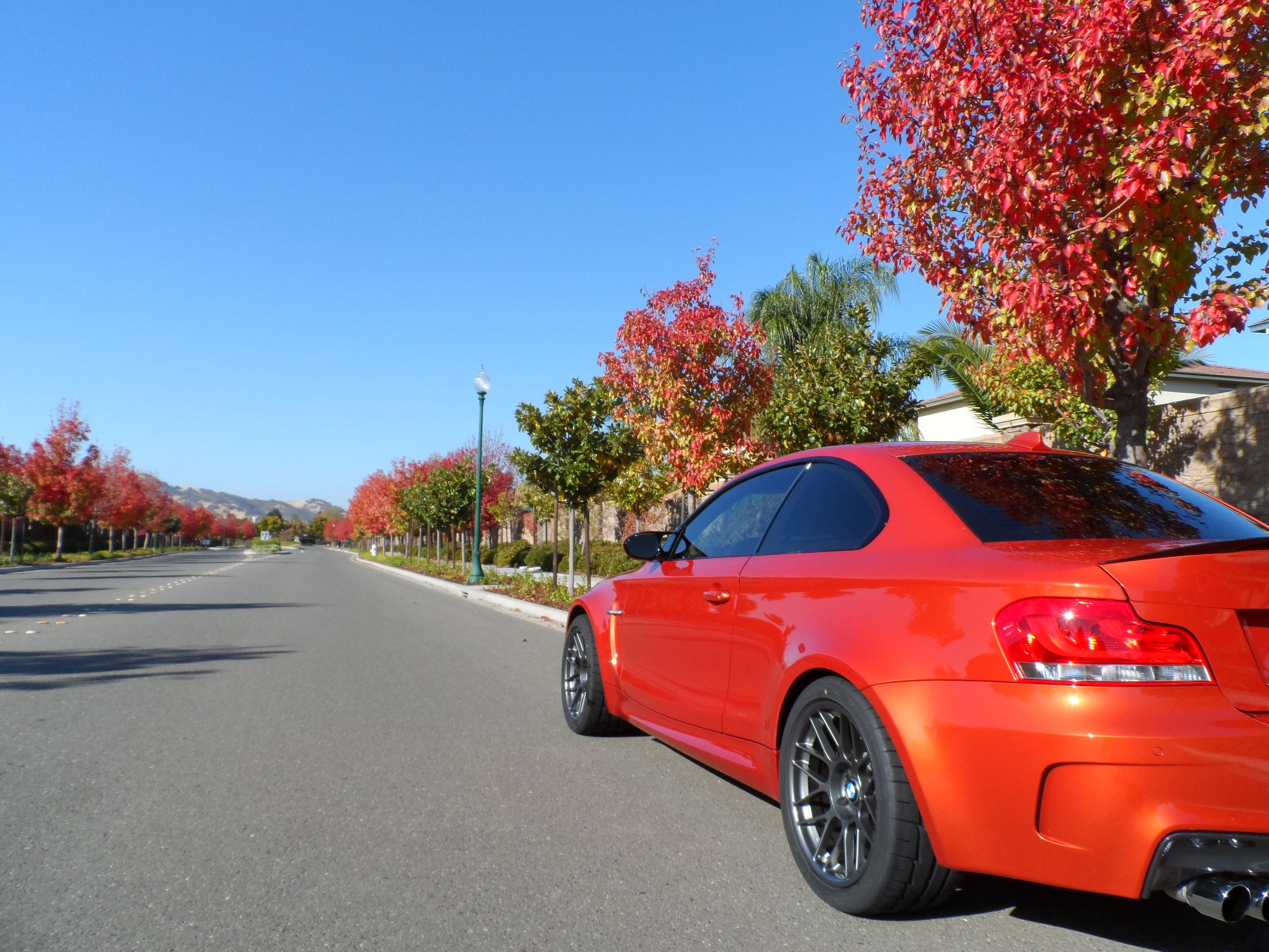 Orange BMW E82 1M with 18" ARC-8 Apex wheels in Satin Black