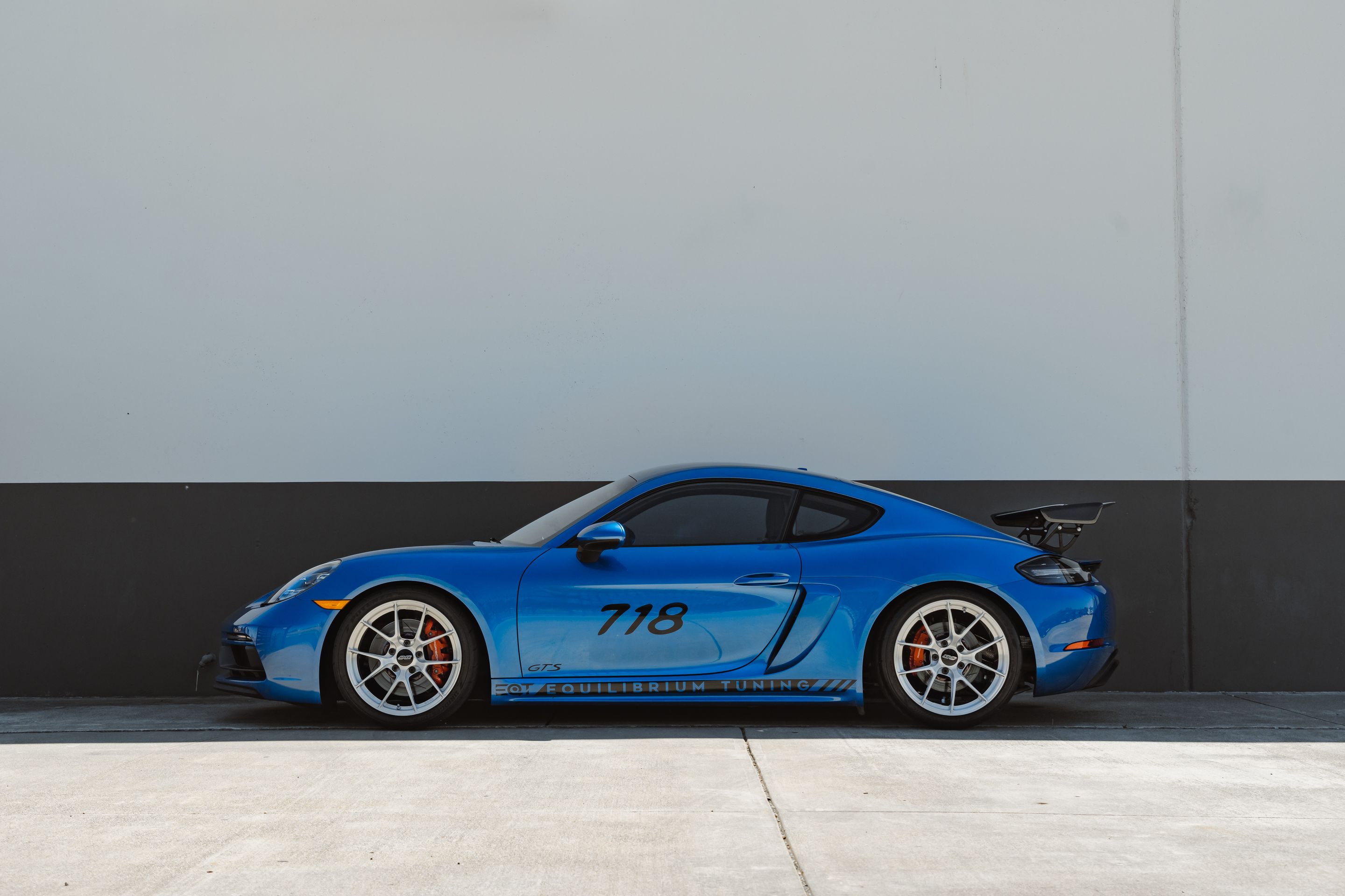 Blue Porsche 718 Cayman GTS 2.5L with 19" VS-5RS Apex wheels in Brushed Clear