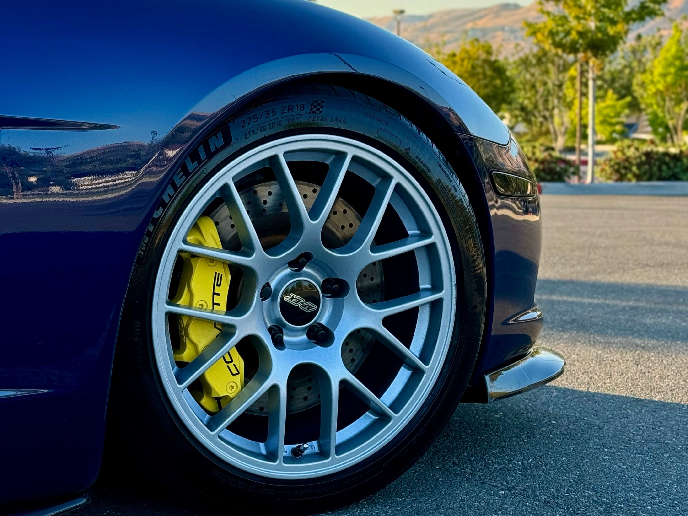 Blue Chevrolet C6 Corvette Base/Z51 with 18"/19" EC-7 Apex wheels in Race Silver