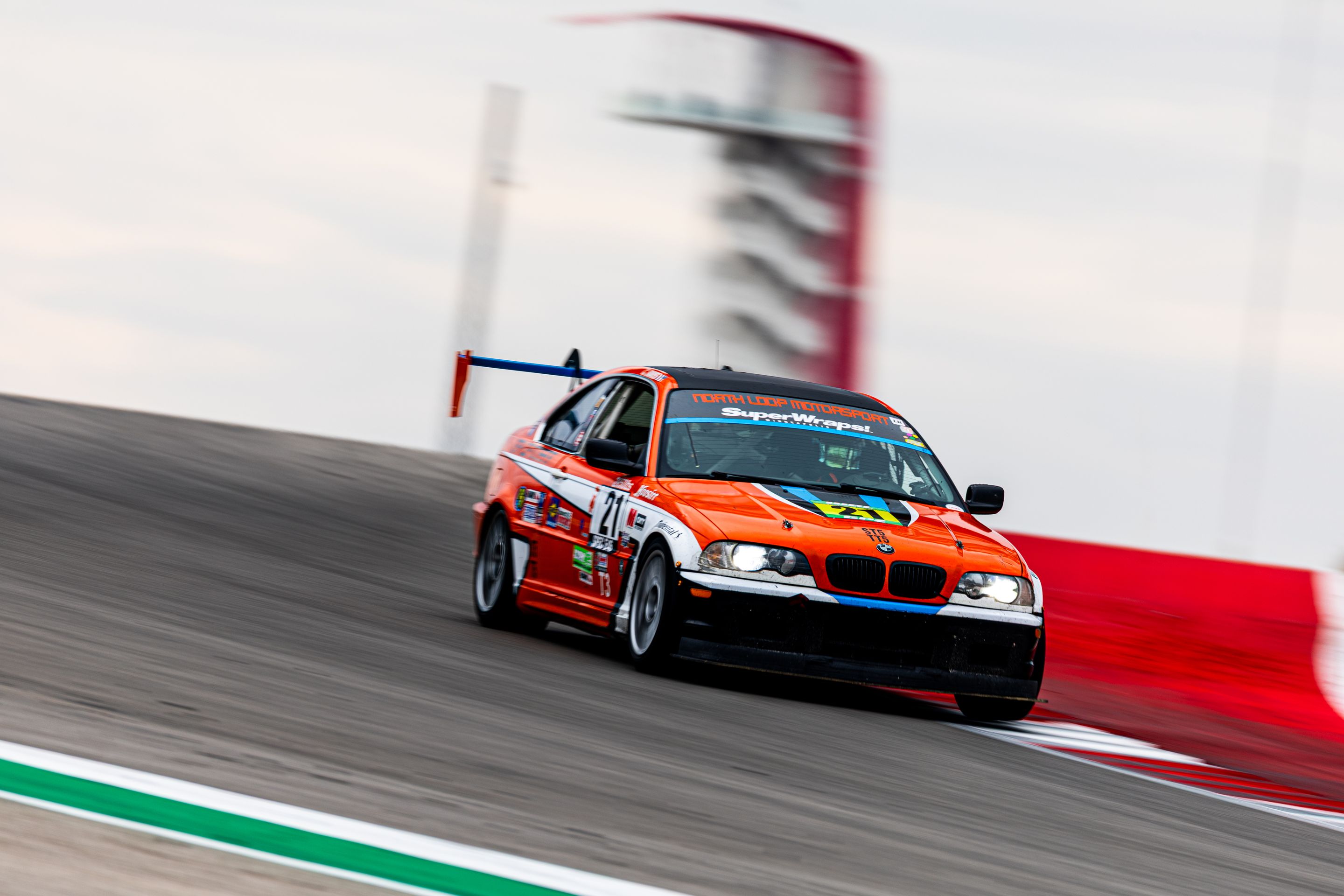 Orange BMW Spec E46 with 17" ARC-8 Apex wheels in Hyper Black