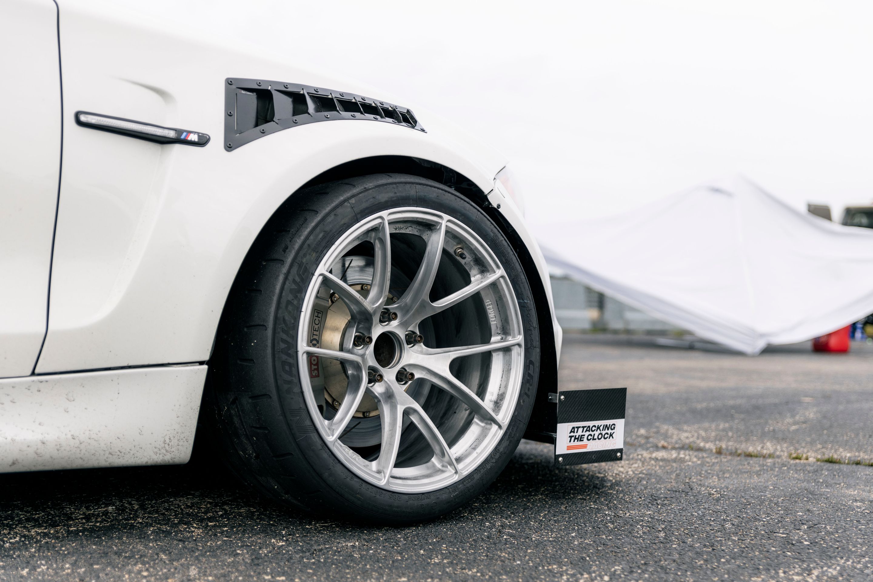 White BMW E82 1M with 18" VS-5RS Apex wheels in Brushed Clear