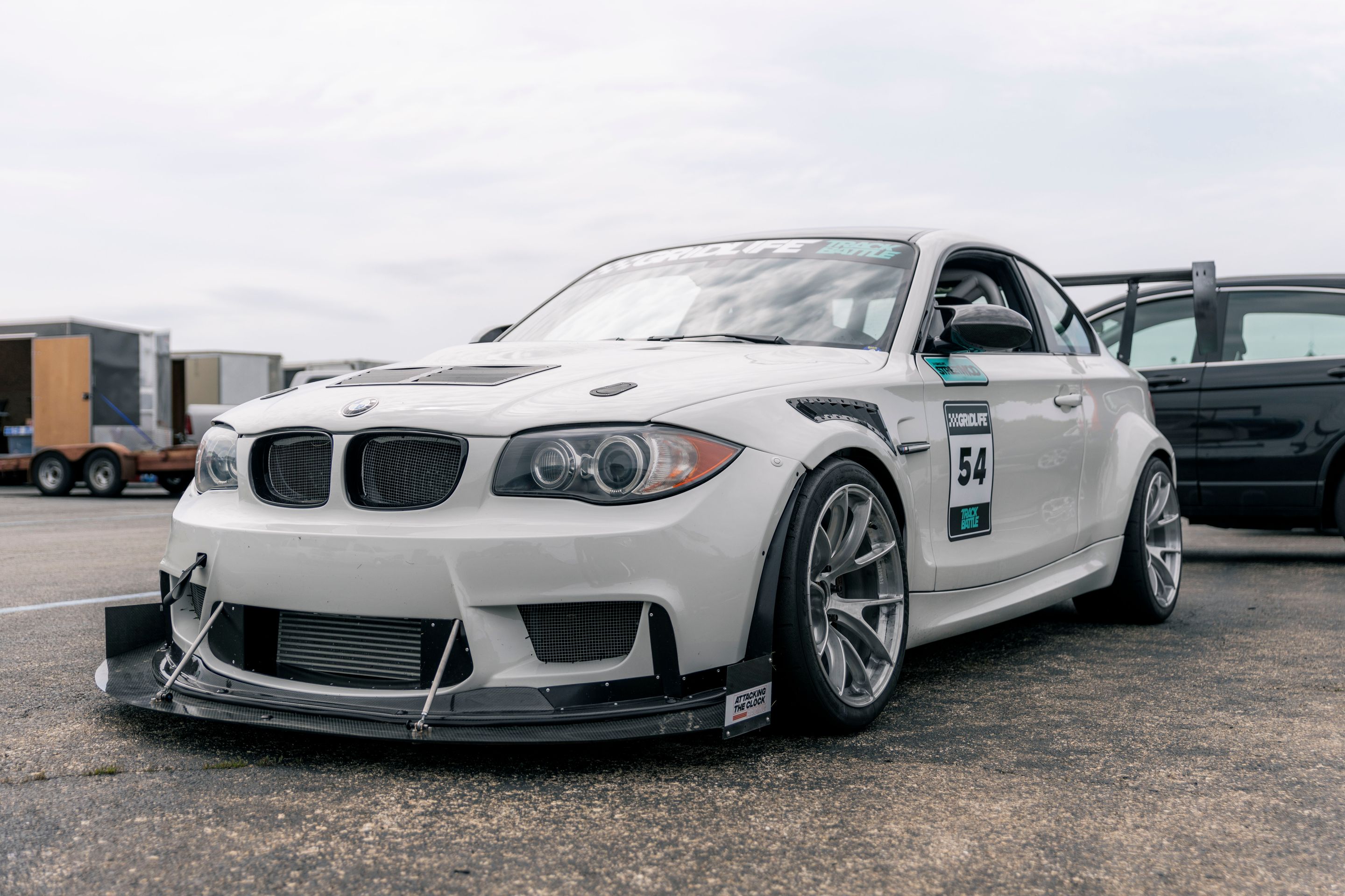 White BMW E82 1M with 18" VS-5RS Apex wheels in Brushed Clear