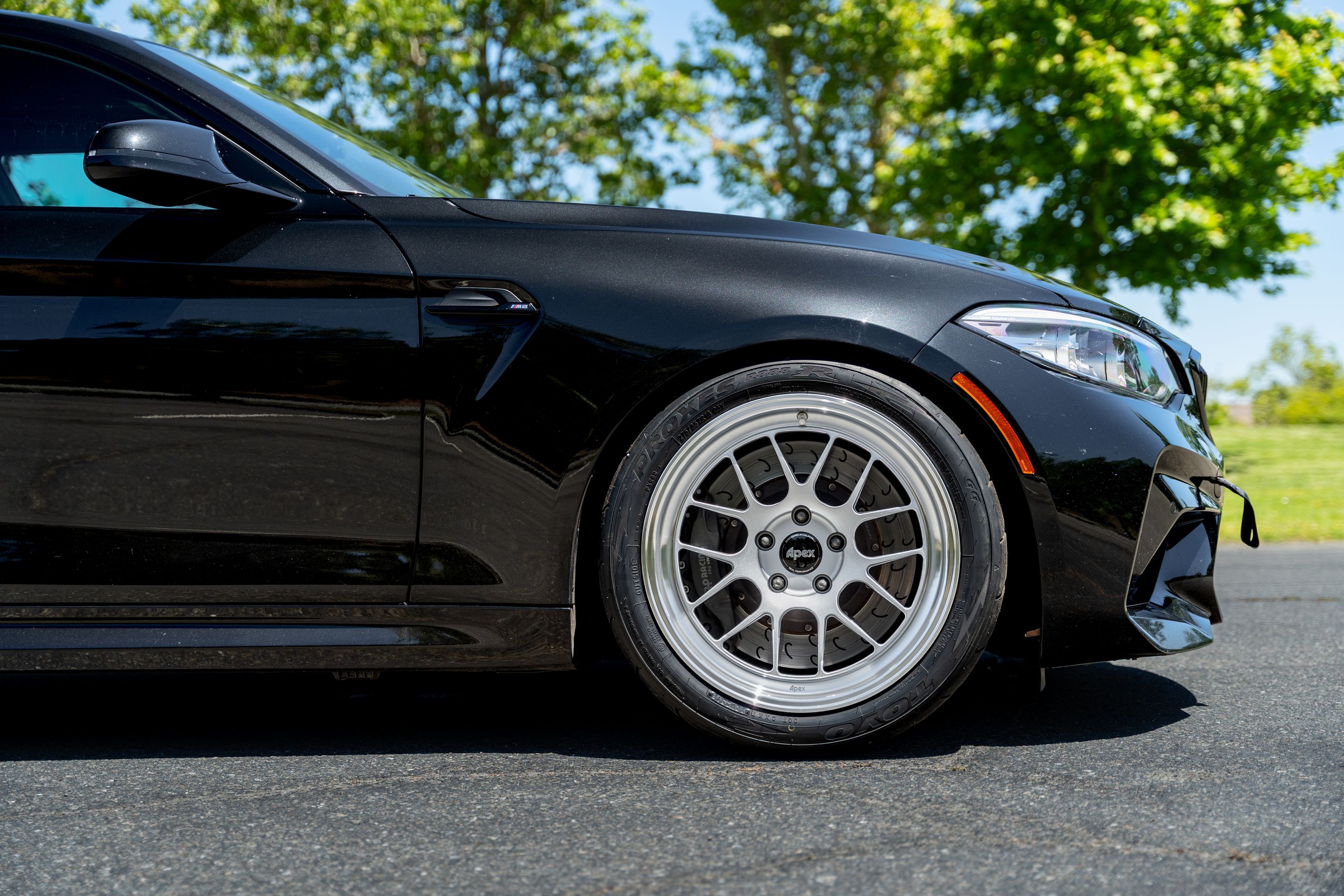 Black BMW F87 M2 with 18" ML-7RT Apex wheels in Machined Lip Race Silver