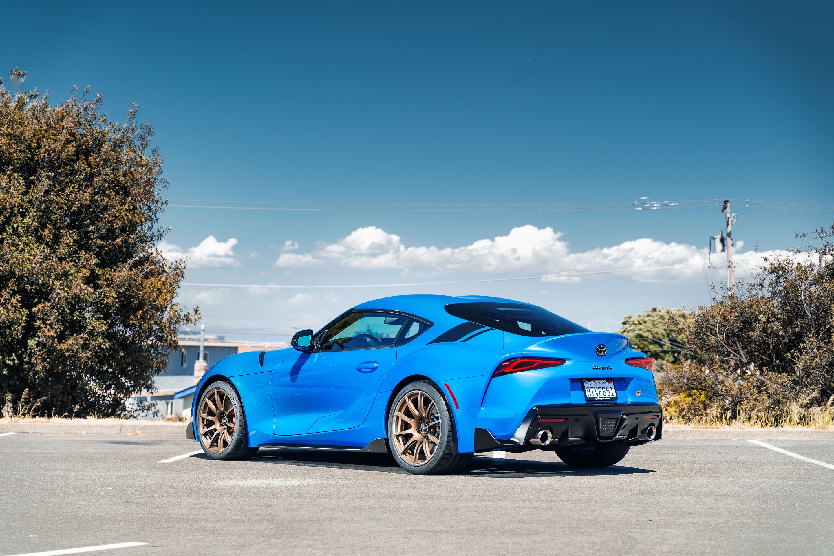 Blue Toyota GR Supra with 19" SM-10 Apex wheels in Satin Bronze