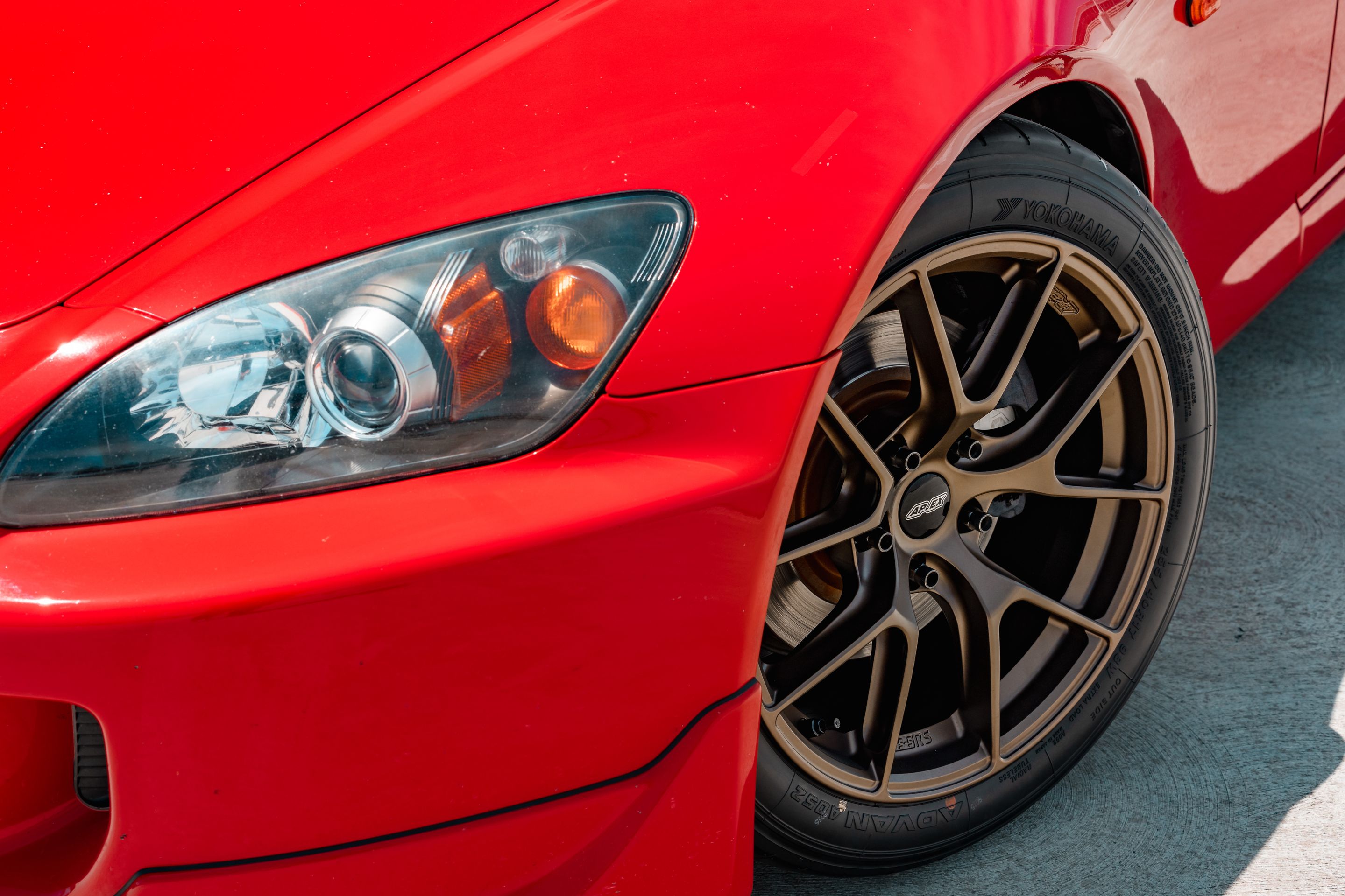 Red Honda S2000 with 17" VS-5RS Apex wheels in Satin Bronze