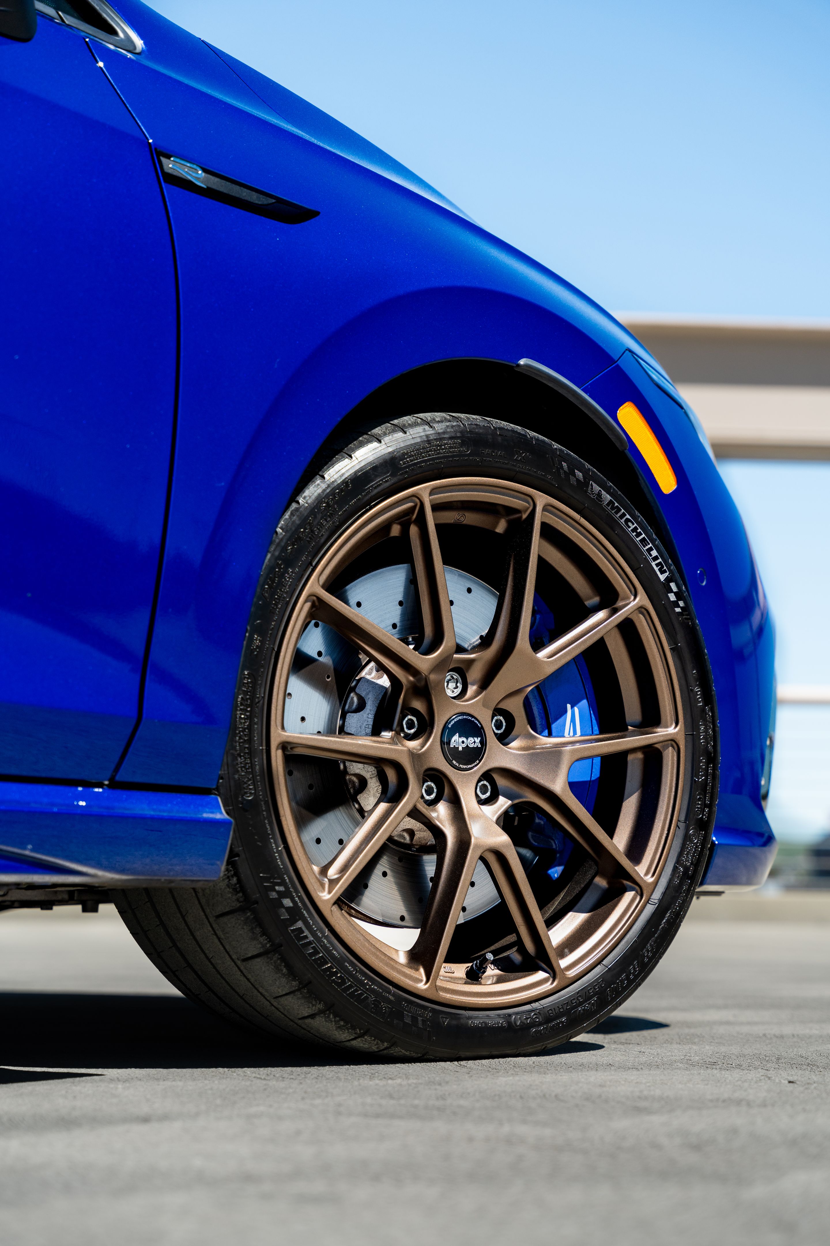 Blue VW MK8 Golf R with 18" VS-5 Apex wheels in Satin Bronze