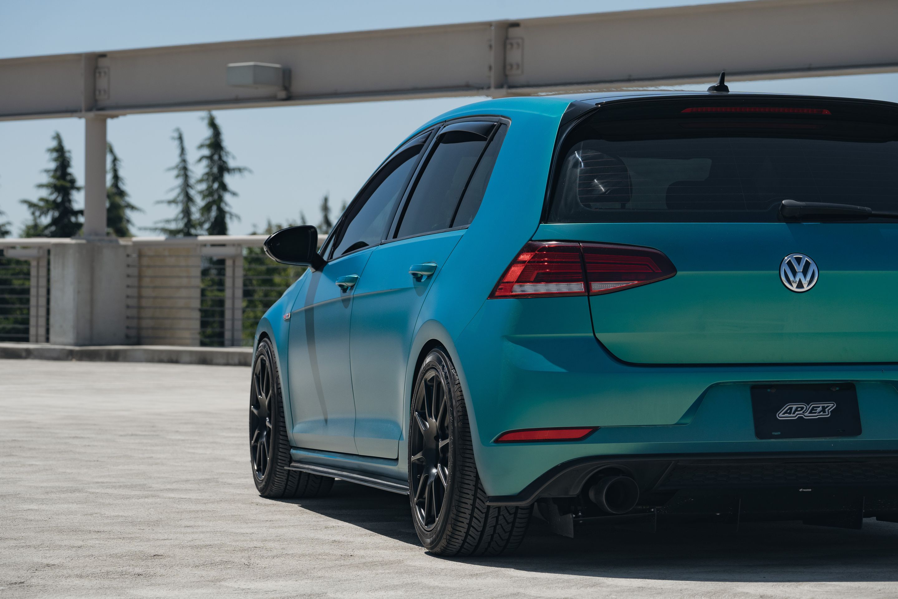 Green VW MK7 GTI with 17" SM-10 Apex wheels in Satin Black