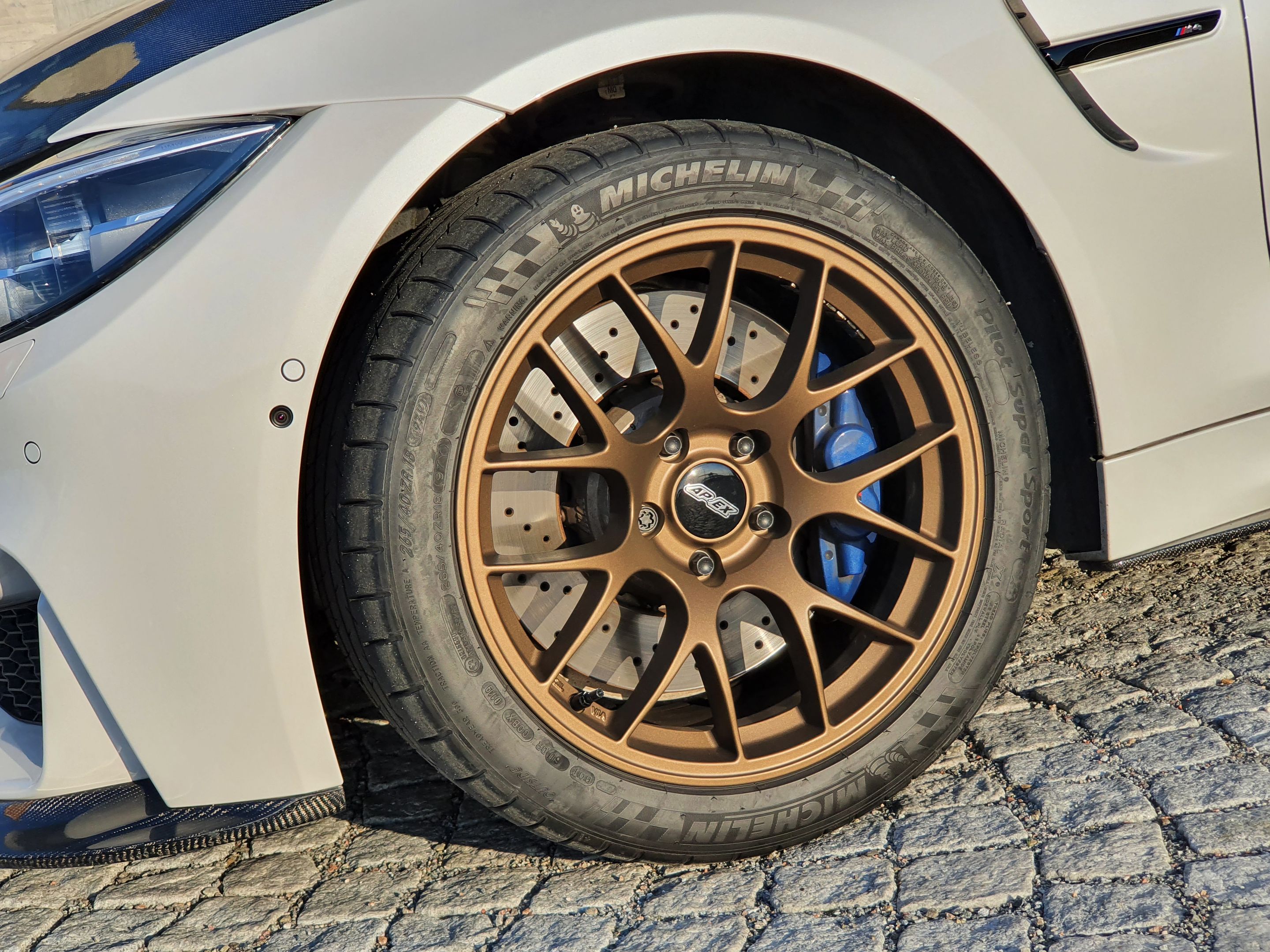 White BMW F82 Coupe M4 with 18" EC-7 Apex wheels in Satin Bronze